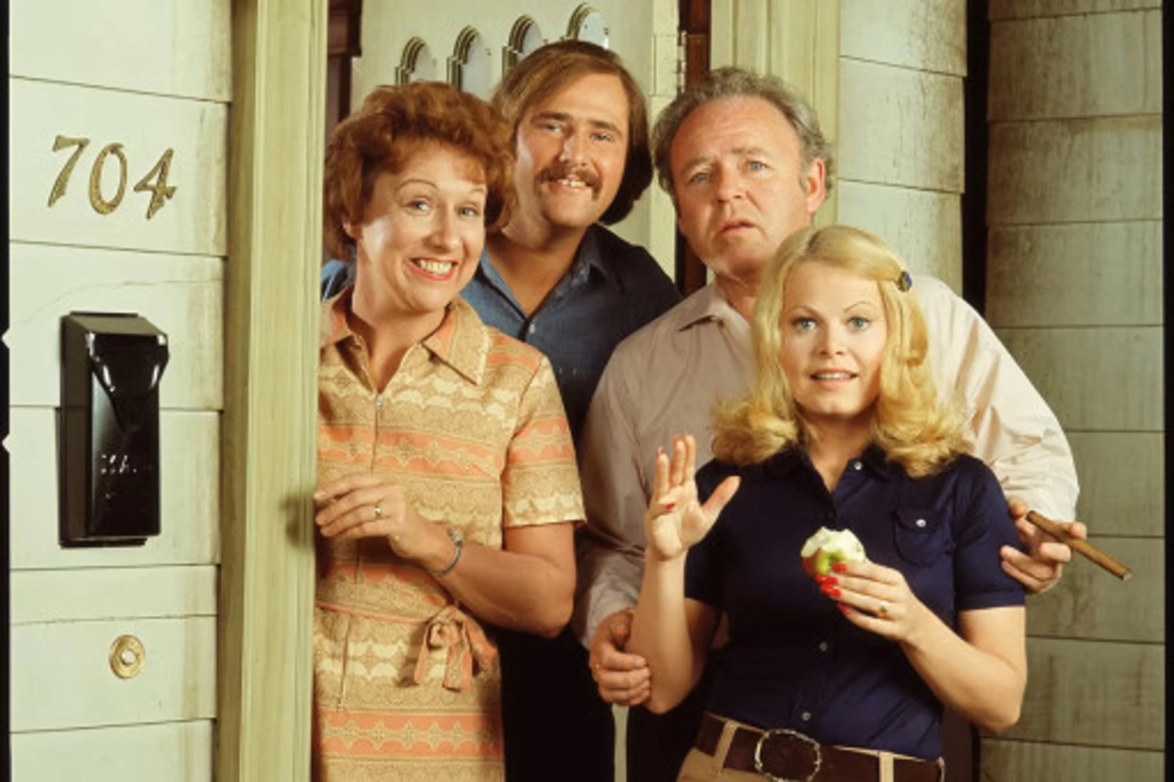 Jean Stapleton, Rob Reiner, Carroll O’Connor and Sally Struthers stand together in an All in the Family publicity photo.