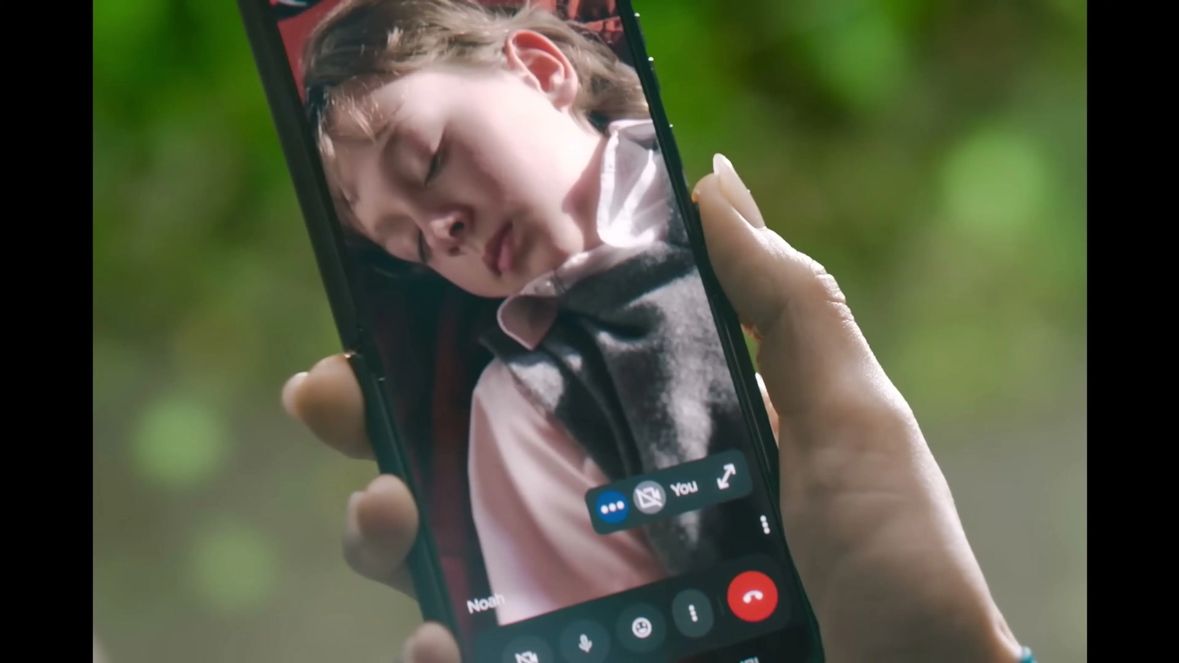 Maia Marten sees her kidnapped son Noah on a phone screen in The Runner.