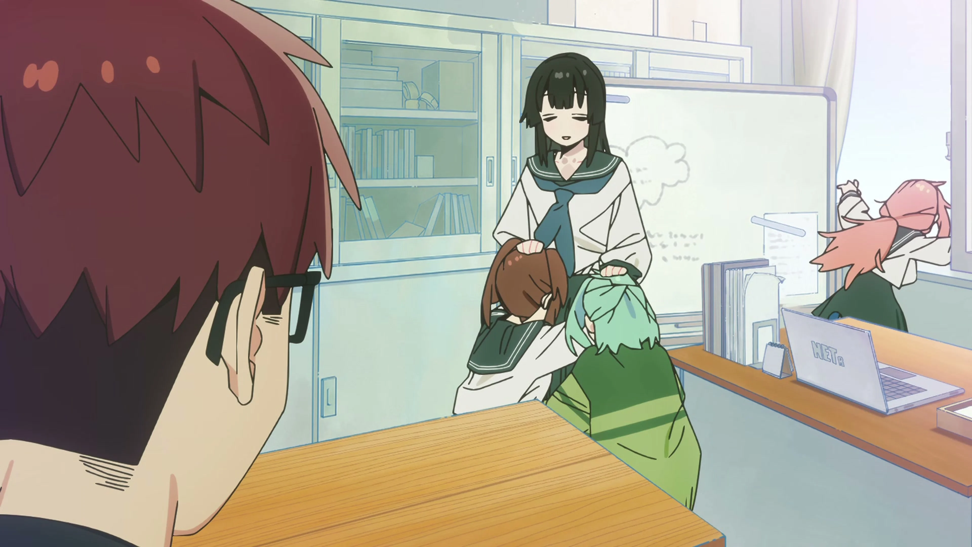The student council gathers around Ume inside its school office.