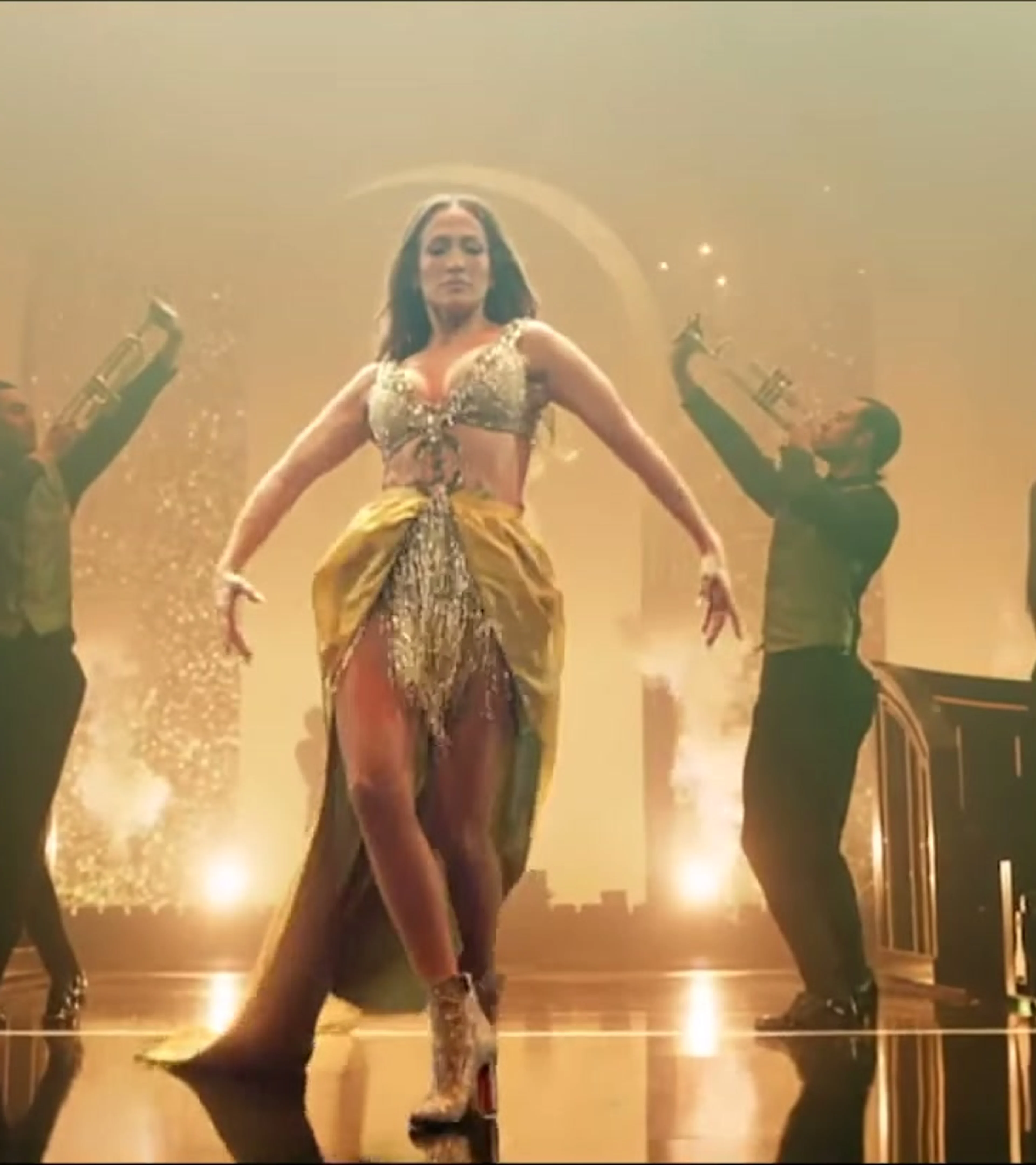 Jennifer Lopez performs onstage with dancers and a live ensemble in The JLO Show.