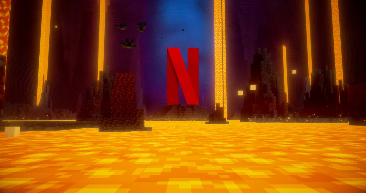 A red Netflix N rises above lava inside a blocky Minecraft Nether cavern.