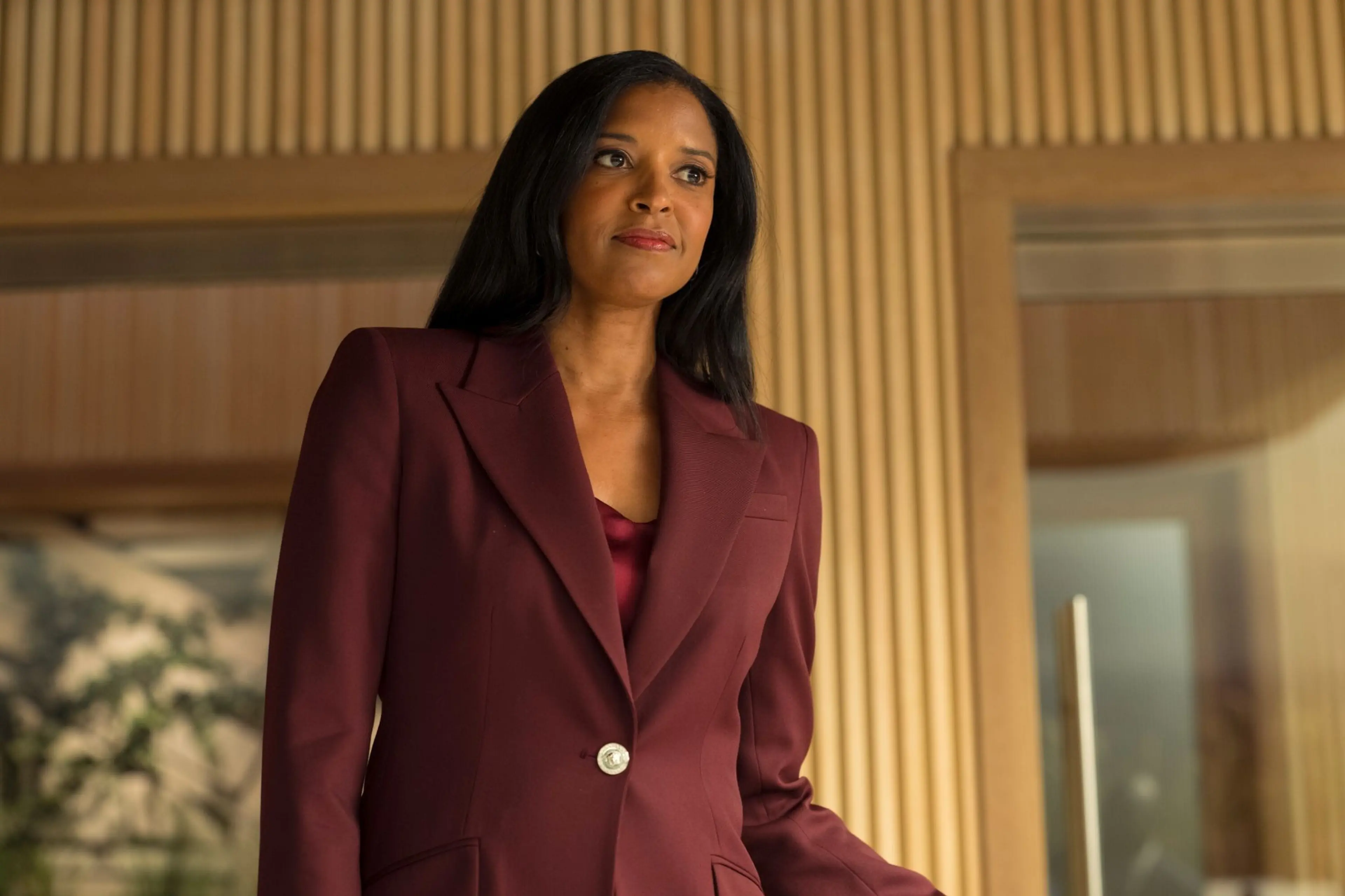 Renée Elise Goldsberry wears a burgundy suit in Cupertino.