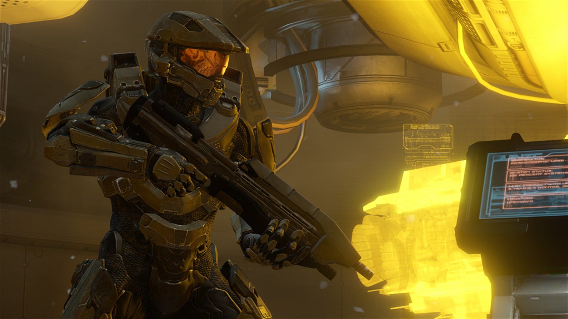 Master Chief holds a rifle in a yellow-lit Halo 4 ship interior.