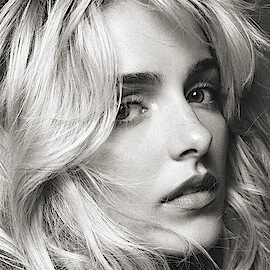 McKenna Grace in a black-and-white promotional portrait.