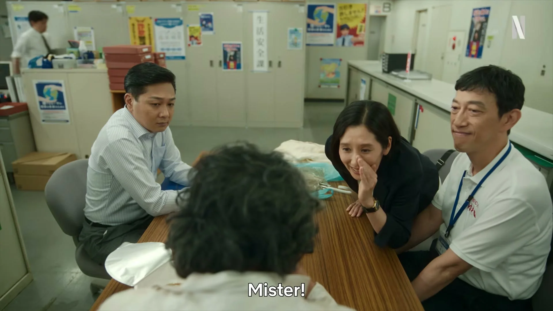 Gen visits an office as three staff members look at him in the Netflix trailer.