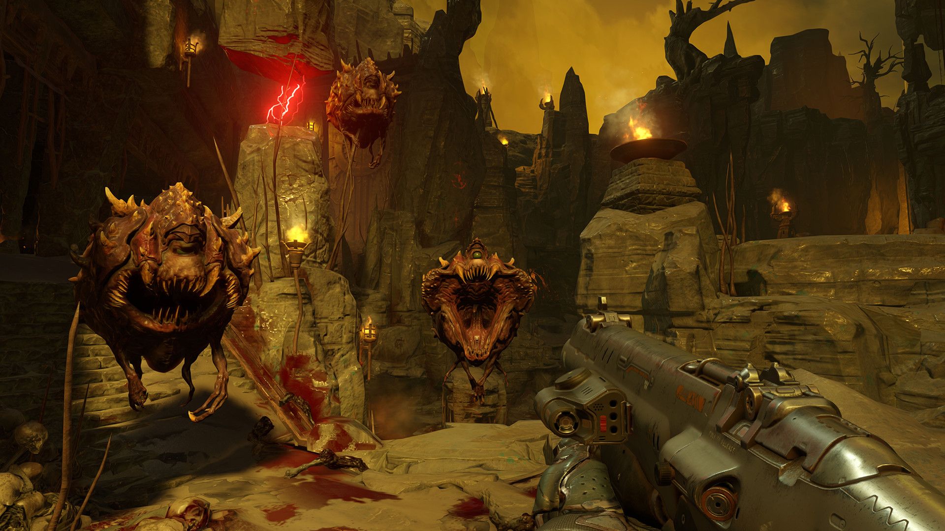 First-person view facing two demons in a rocky arena.