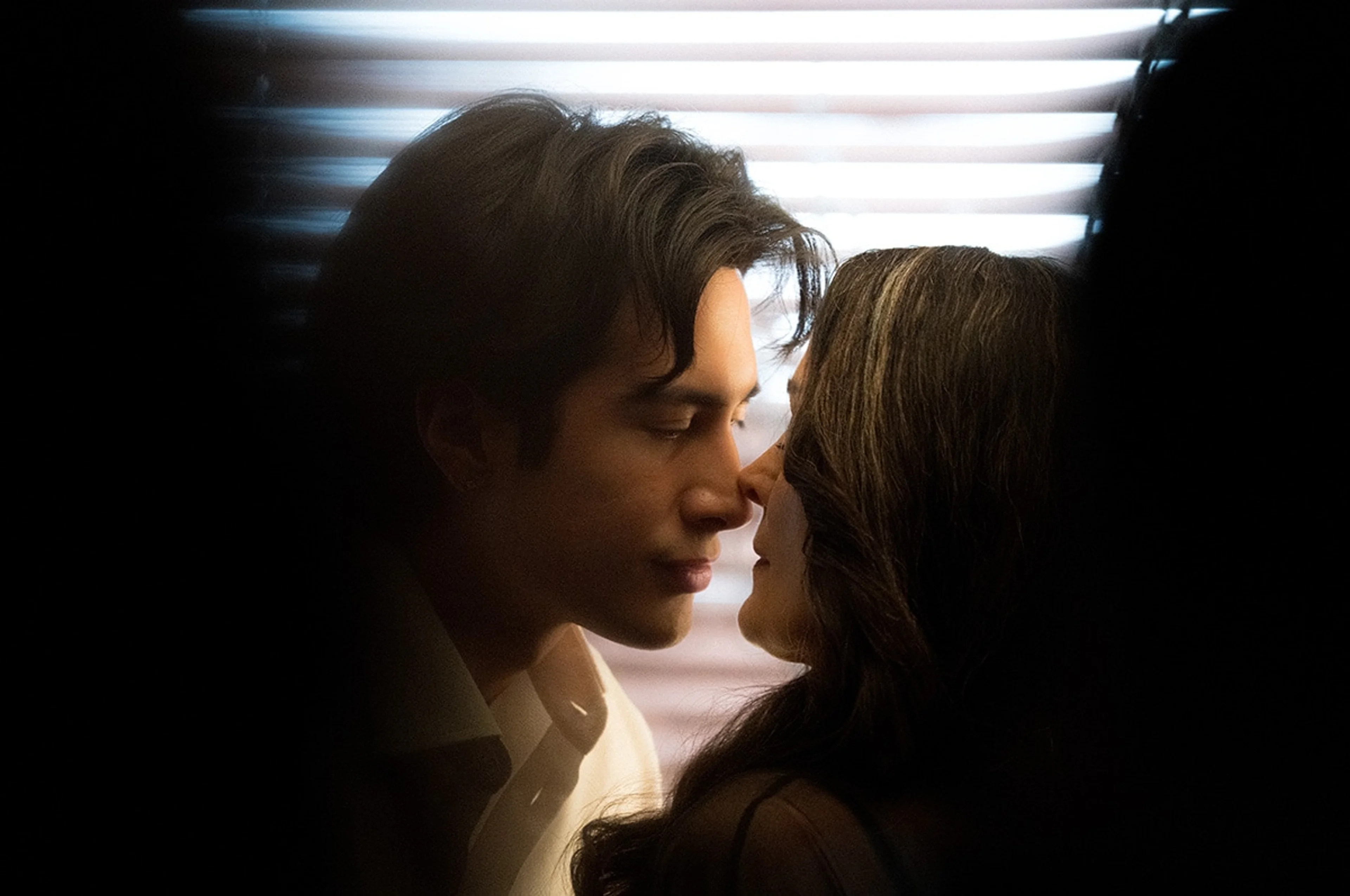 Carrie-Anne Moss as Katherine and Hudson Williams as Henry Park stand close together.
