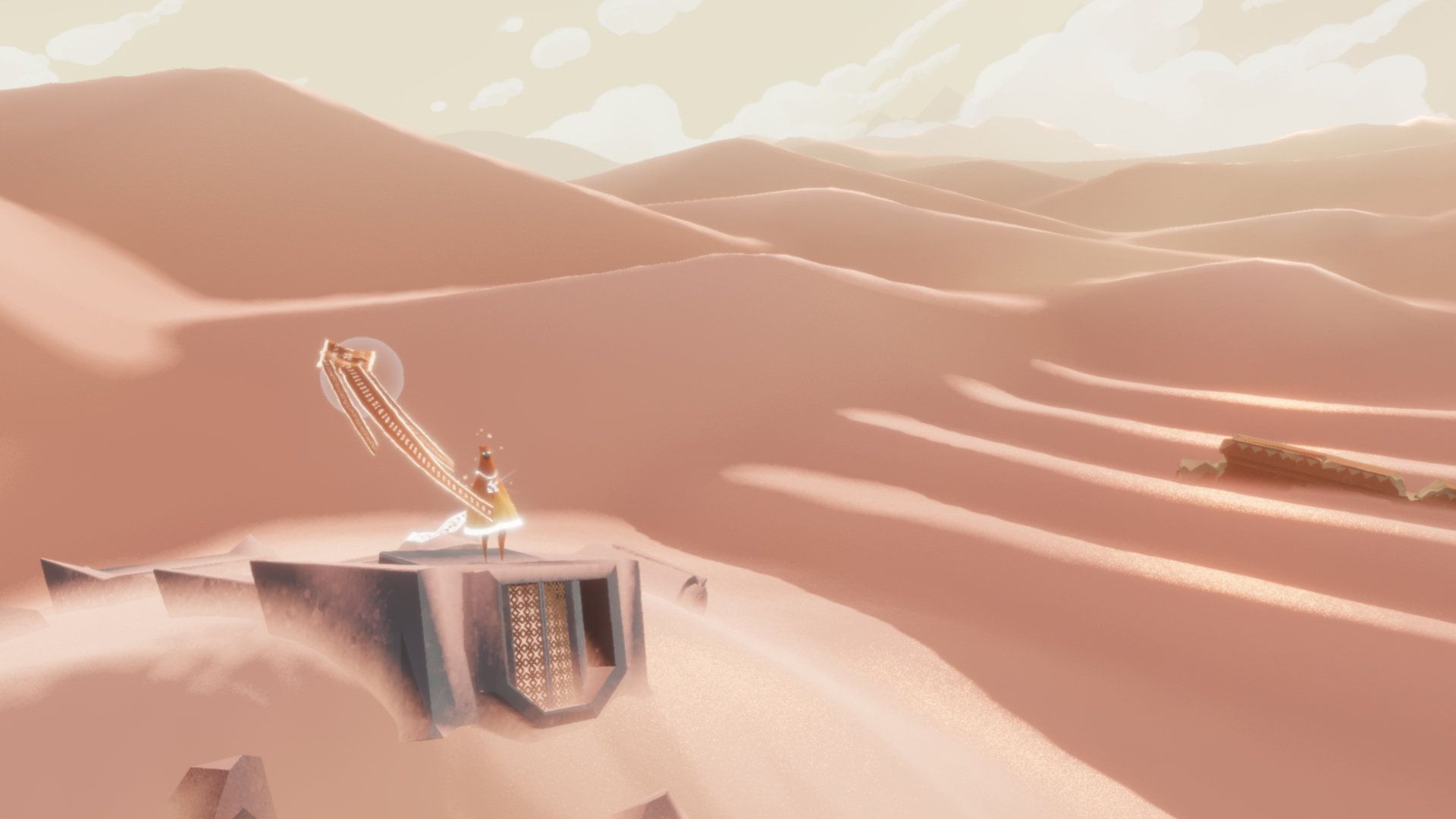 The traveler stands near flowing cloth on a platform among pale sand dunes.