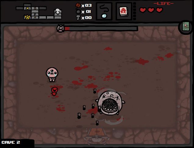 Isaac fighting a large circular boss in Cave 2 beneath a boss health bar.