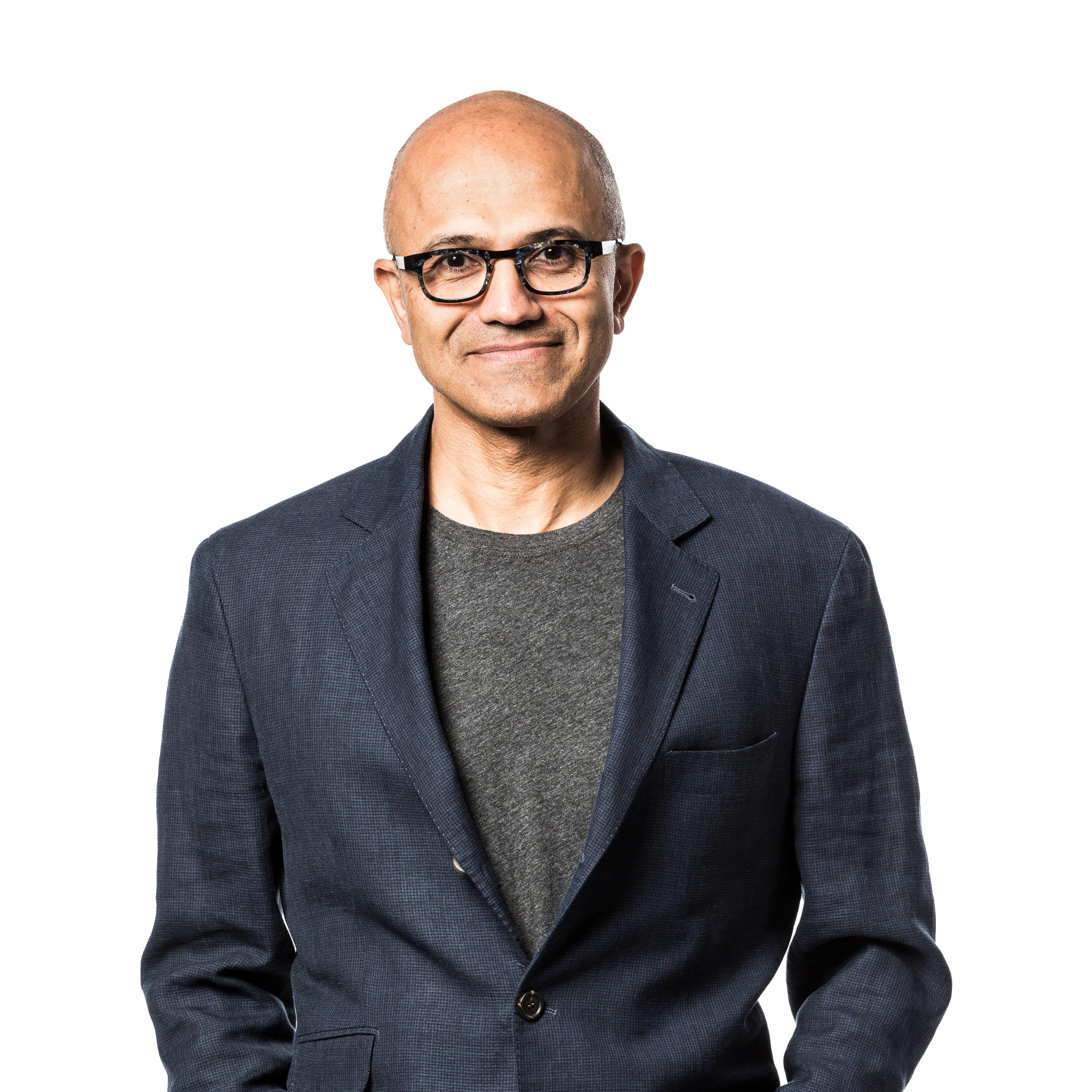 Microsoft CEO Satya Nadella stands against a white background.