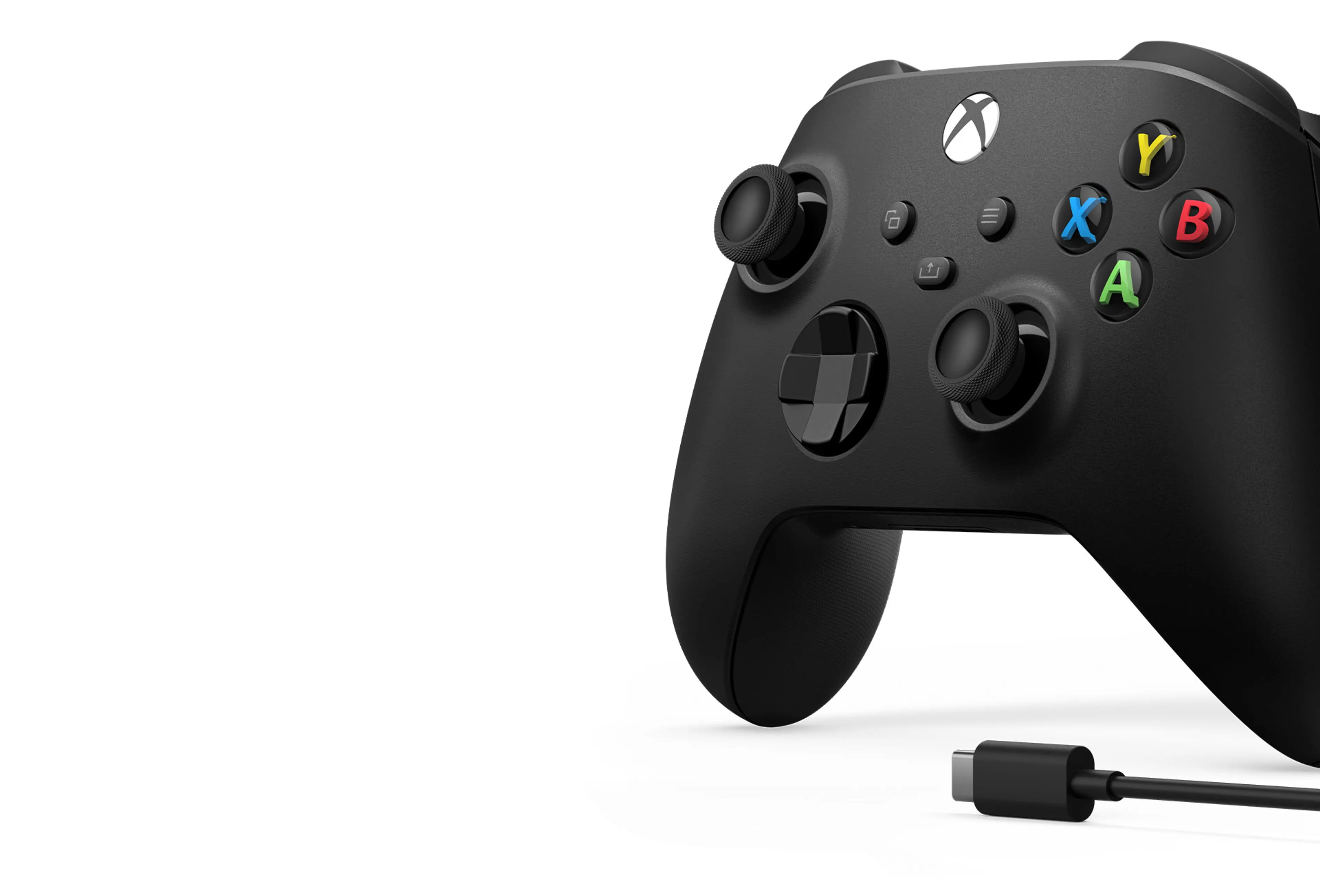Close-up of a Carbon Black Xbox Wireless Controller beside a USB-C connector