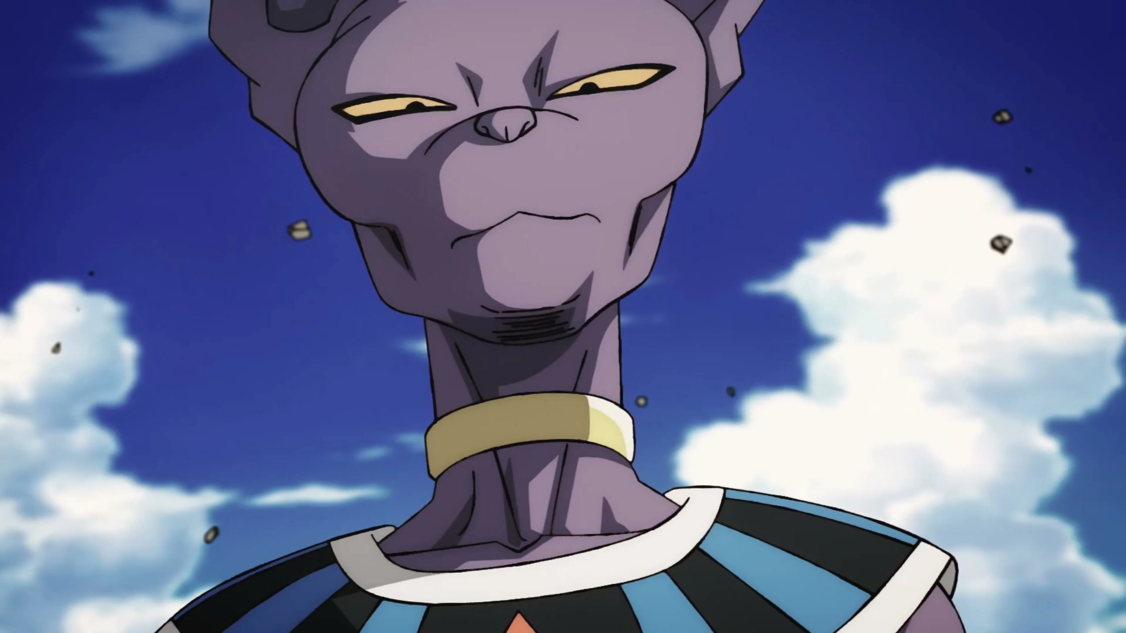 Beerus looks down against a blue sky as debris floats around him.