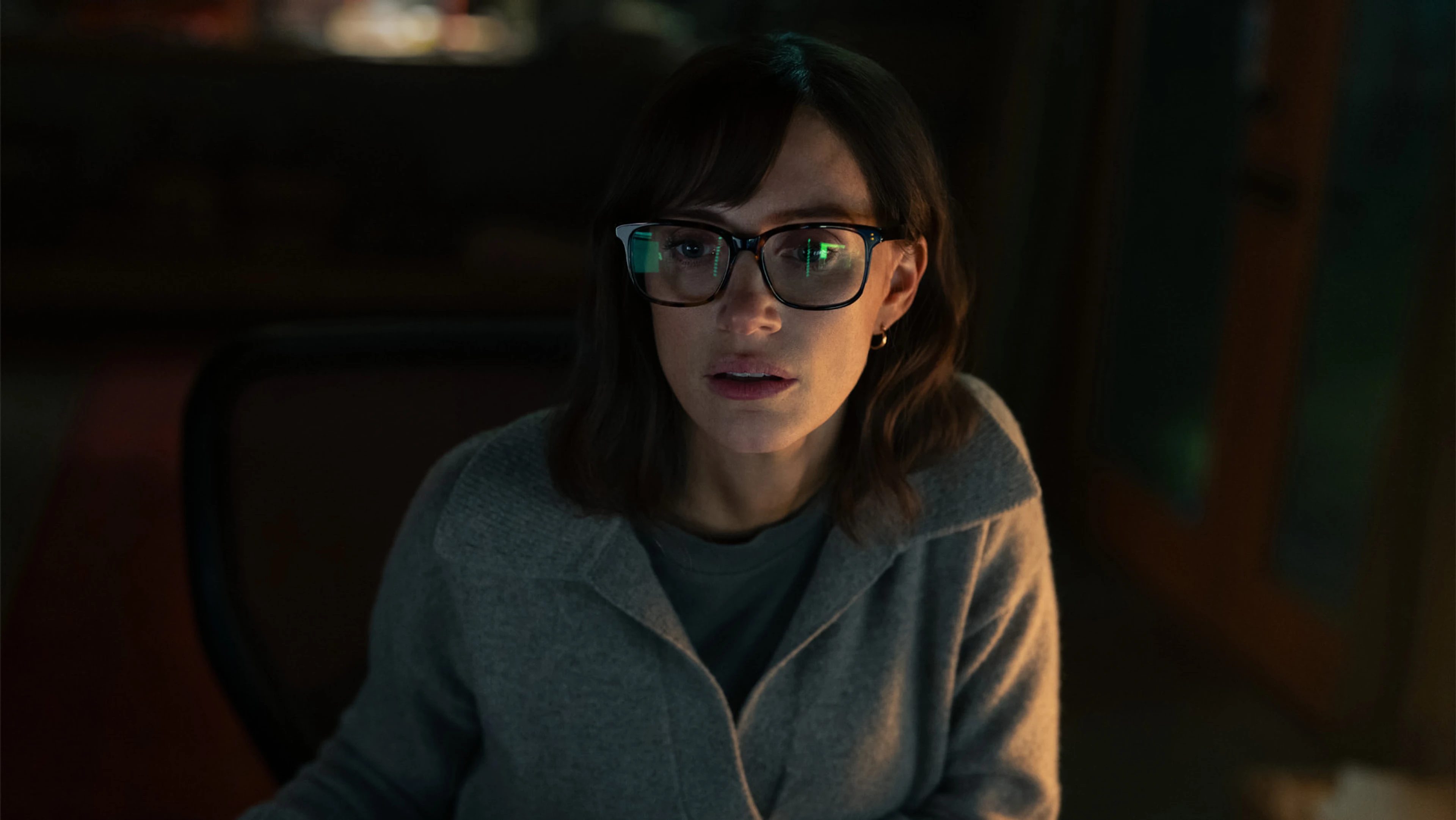 Jessica Chastain looks at a computer screen as the investigator in The Savant.