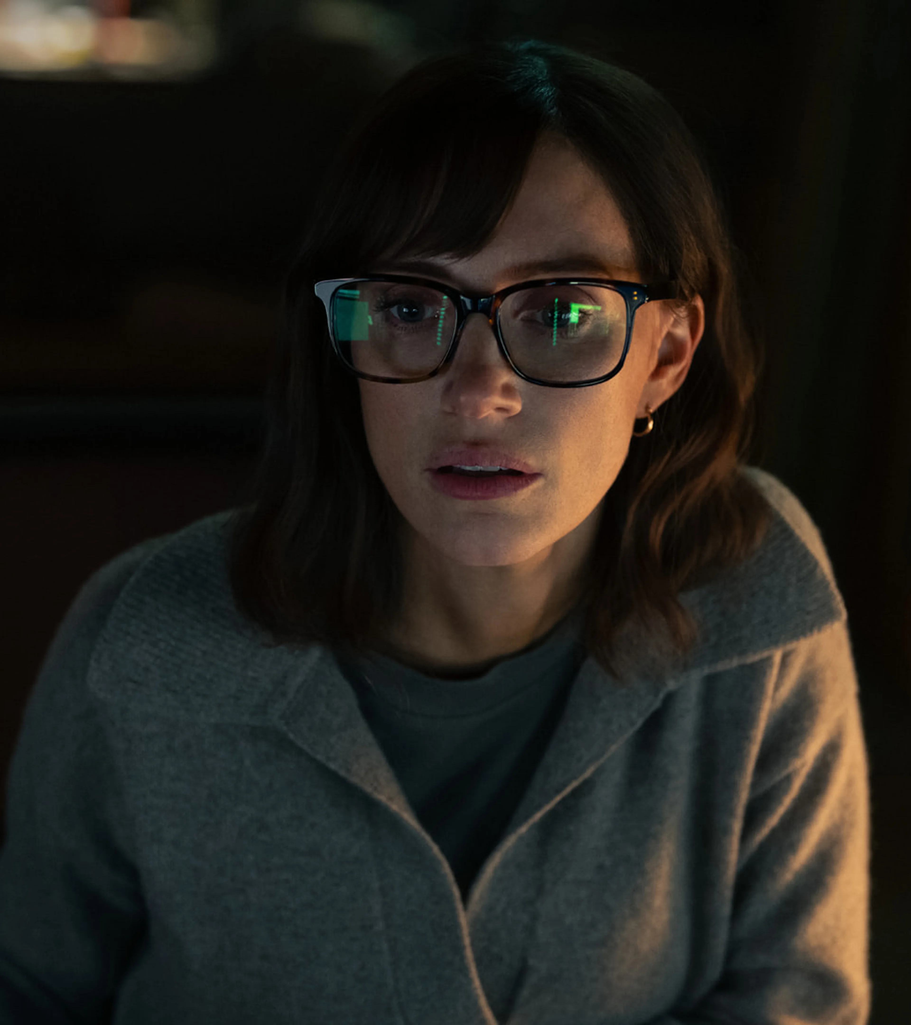 Jessica Chastain looks at a computer screen as the investigator in The Savant.
