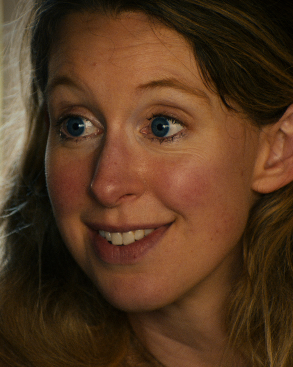 Elizabeth Holmes looks to the side in a vertical still from You Can See Everything.
