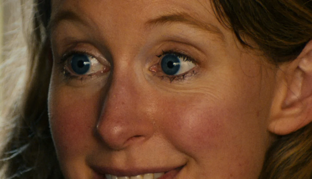 Elizabeth Holmes looks to the side in a vertical still from You Can See Everything.