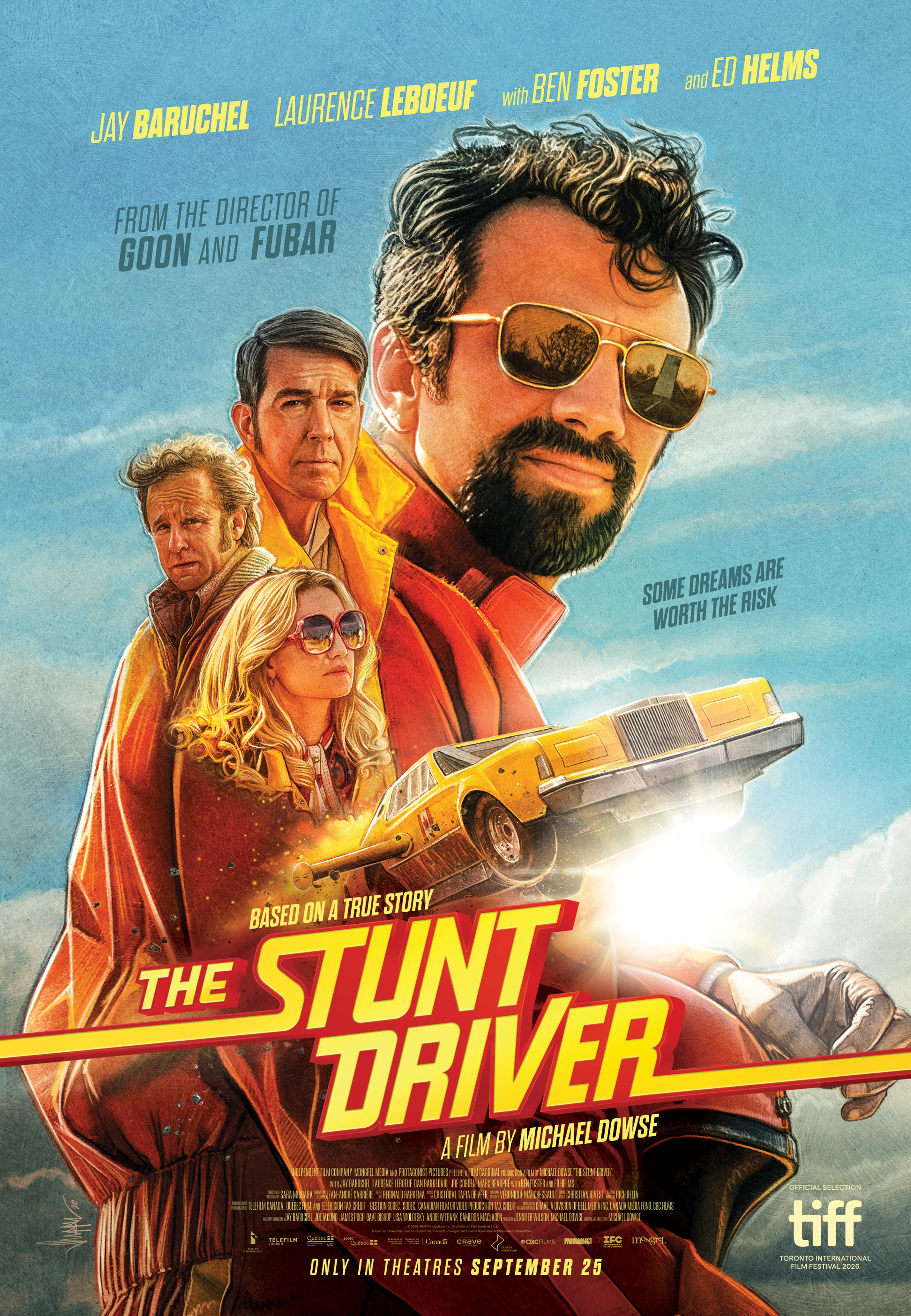 A man in a yellow jacket stands beside a yellow rocket car in The Stunt Driver.