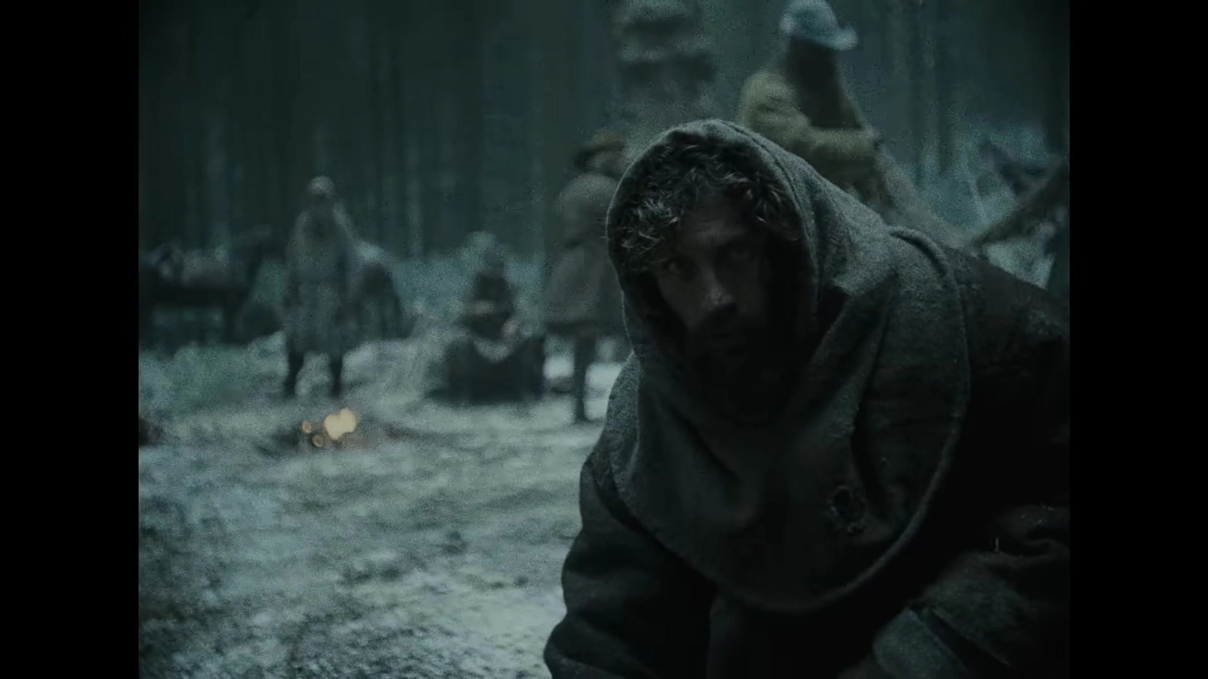 Aaron Taylor-Johnson crouches in a bleak medieval settlement in Werwulf.