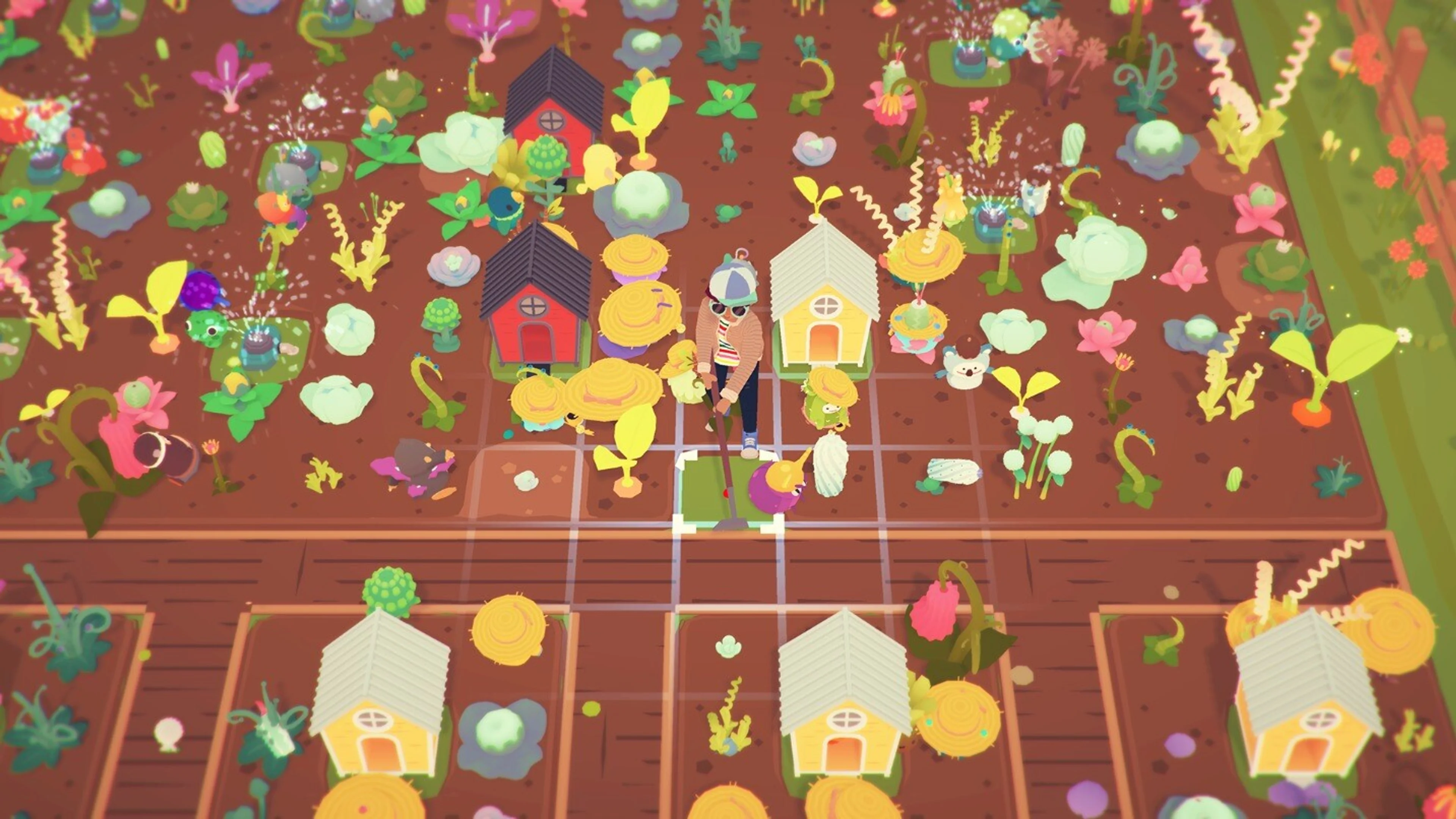 Ooblets face each other on a colorful dance battle grid.