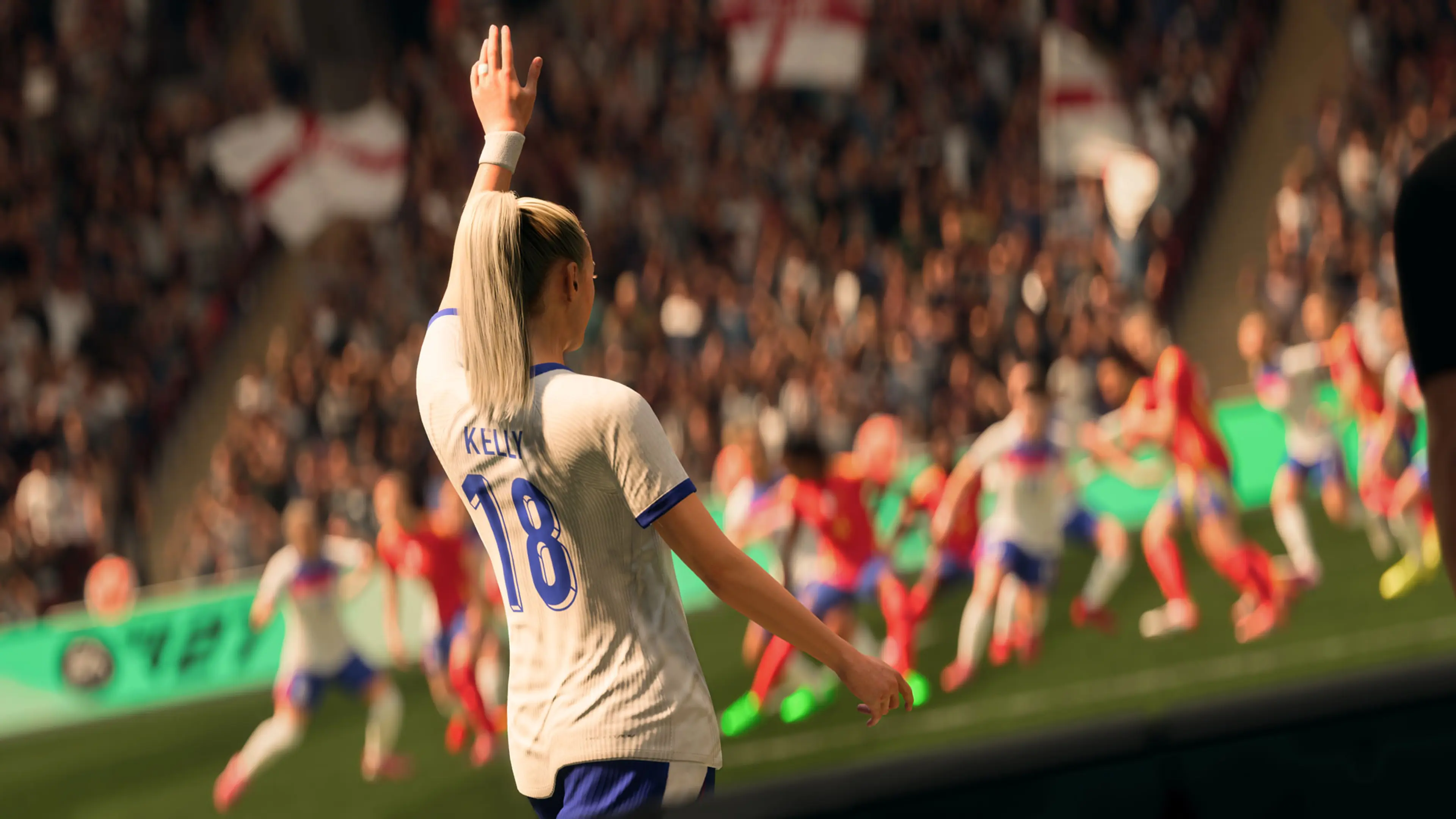Chloe Kelly’s game character raises an arm in an England shirt bearing Kelly and number 18.