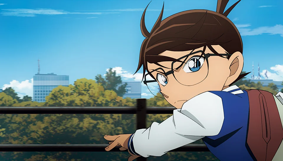 Conan Edogawa looks across a city skyline in Detective Conan: One-Eyed Flashback.