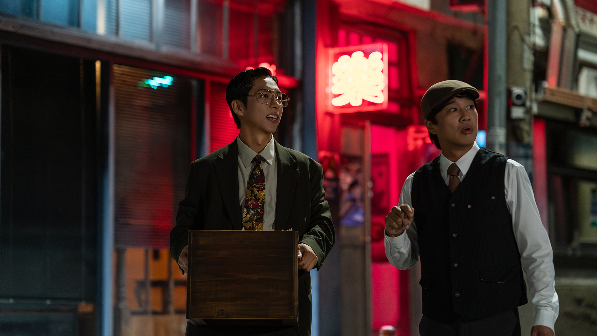 Joo Jong-hyuk and Cha Tae-hyun stand on a nighttime street in Your Personal Taxi.