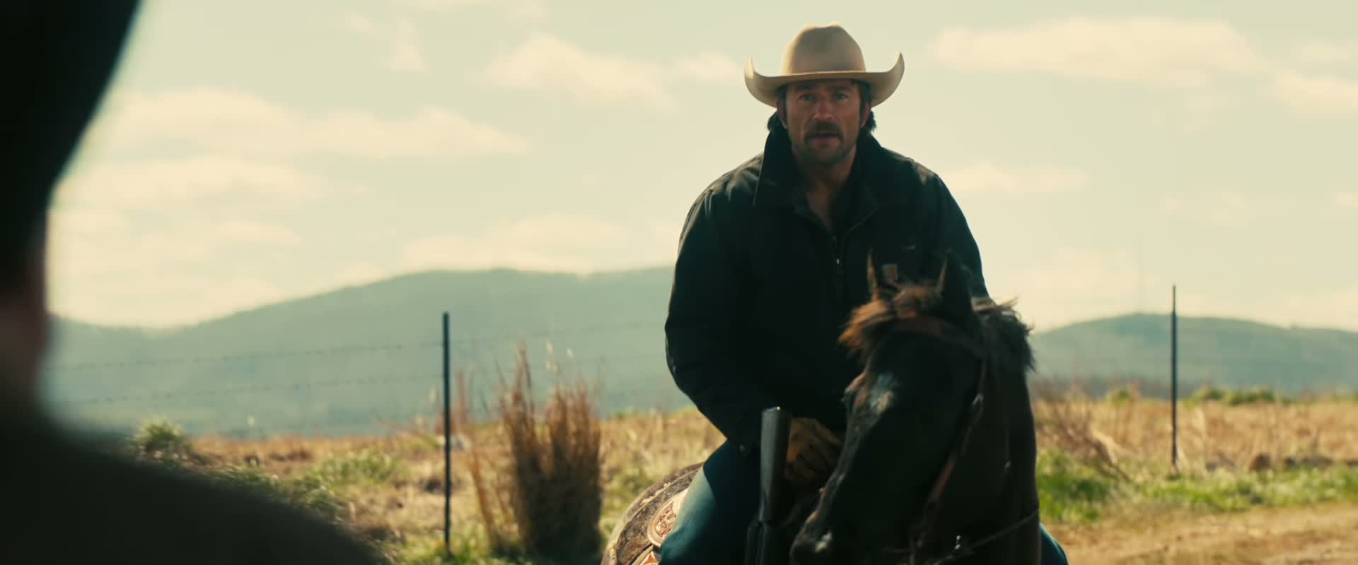 The cowboy rides with his dog in The Rescue.