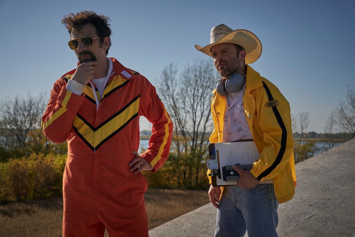 Jay Baruchel as Ken Carter stands beside Ben Foster as Evel Knievel.
