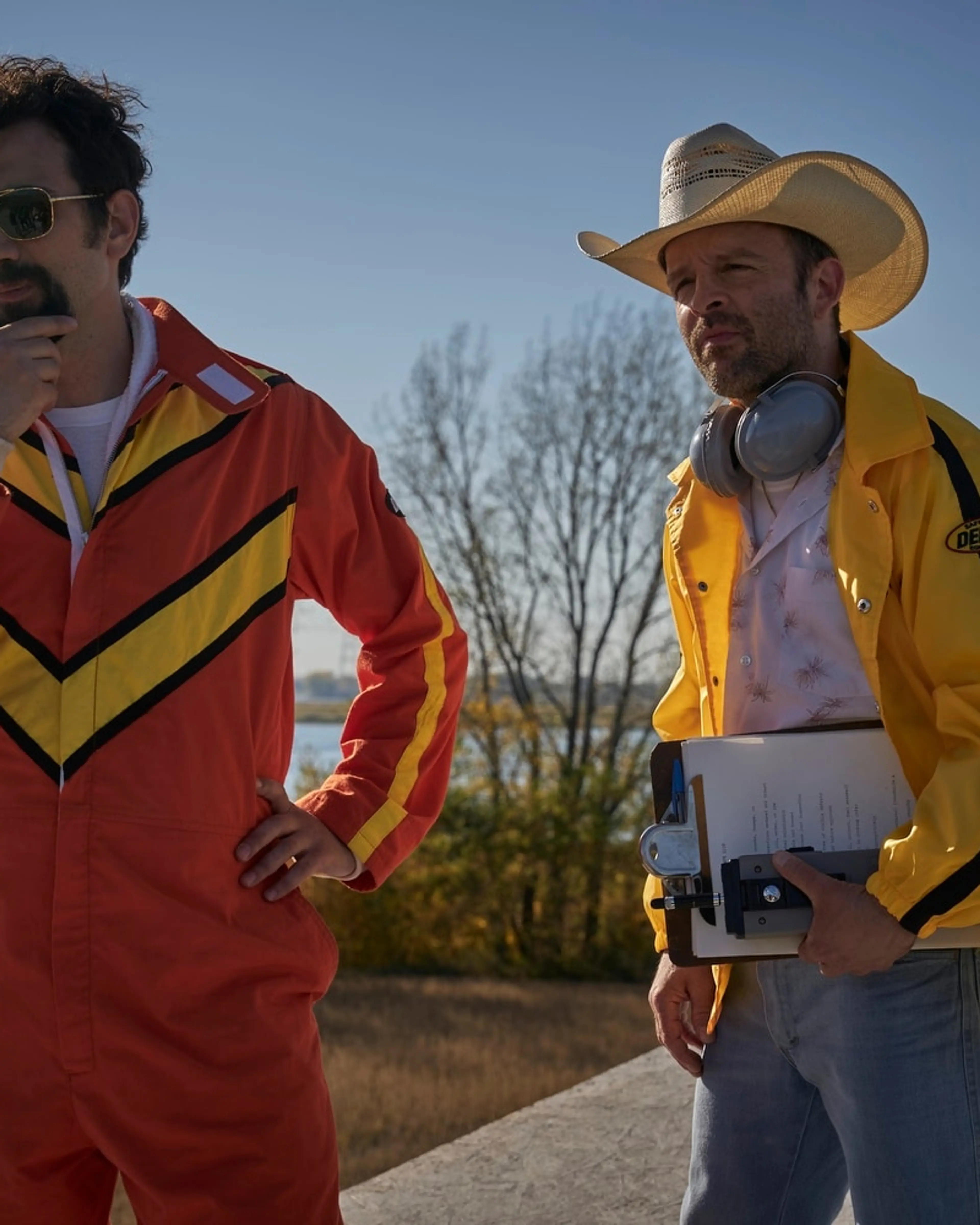 Jay Baruchel as Ken Carter stands beside Ben Foster as Evel Knievel.