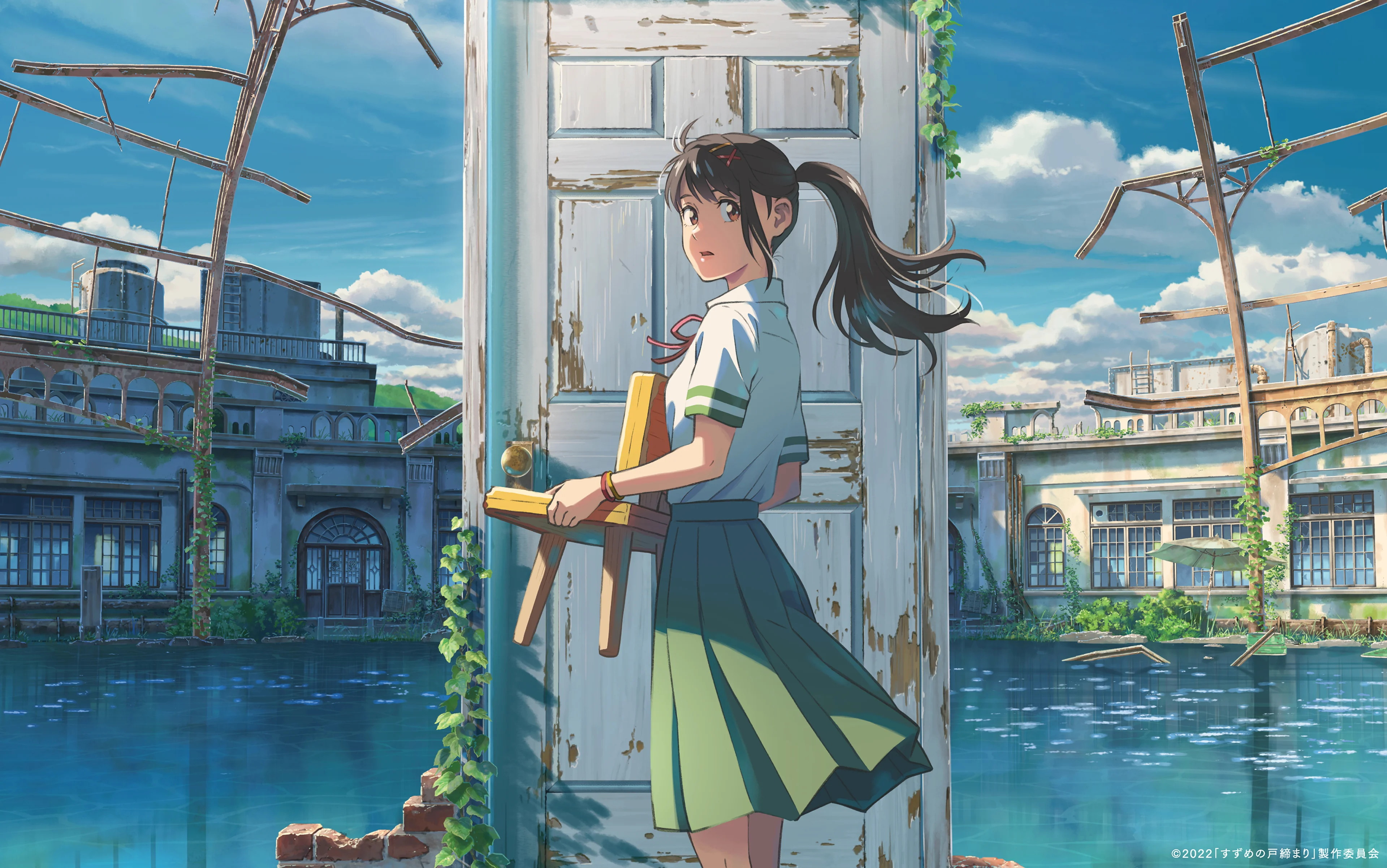 Suzume carries a small chair as she approaches a weathered door.