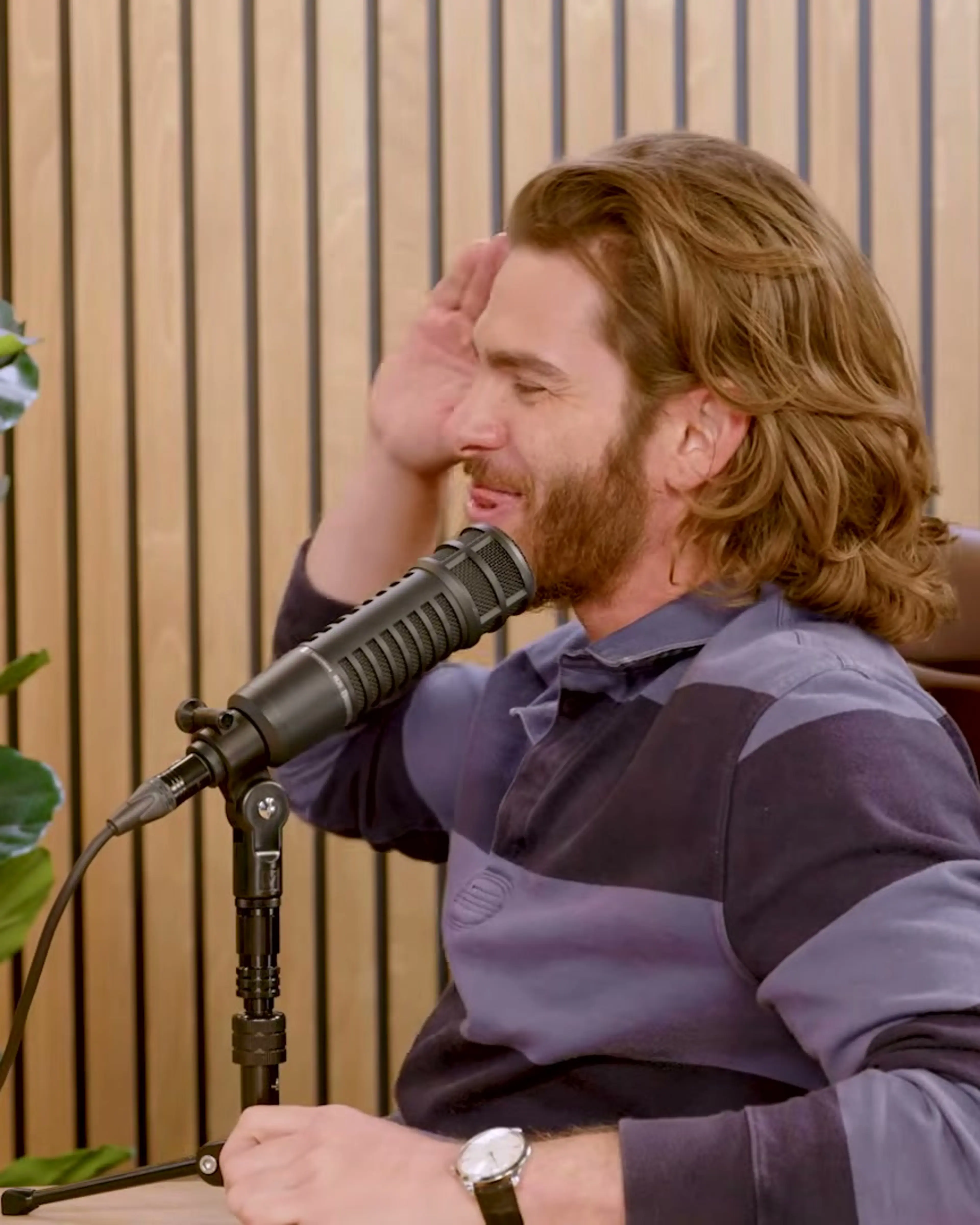 Andrew Garfield raises a hand while explaining his approach to acting.