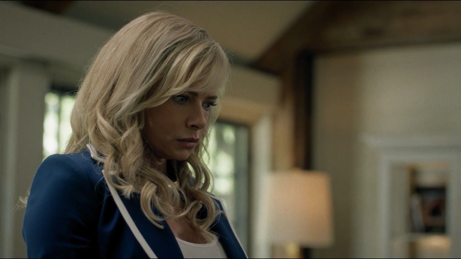Jaime Pressly as Lexi looks to one side inside a house in Last Shot.