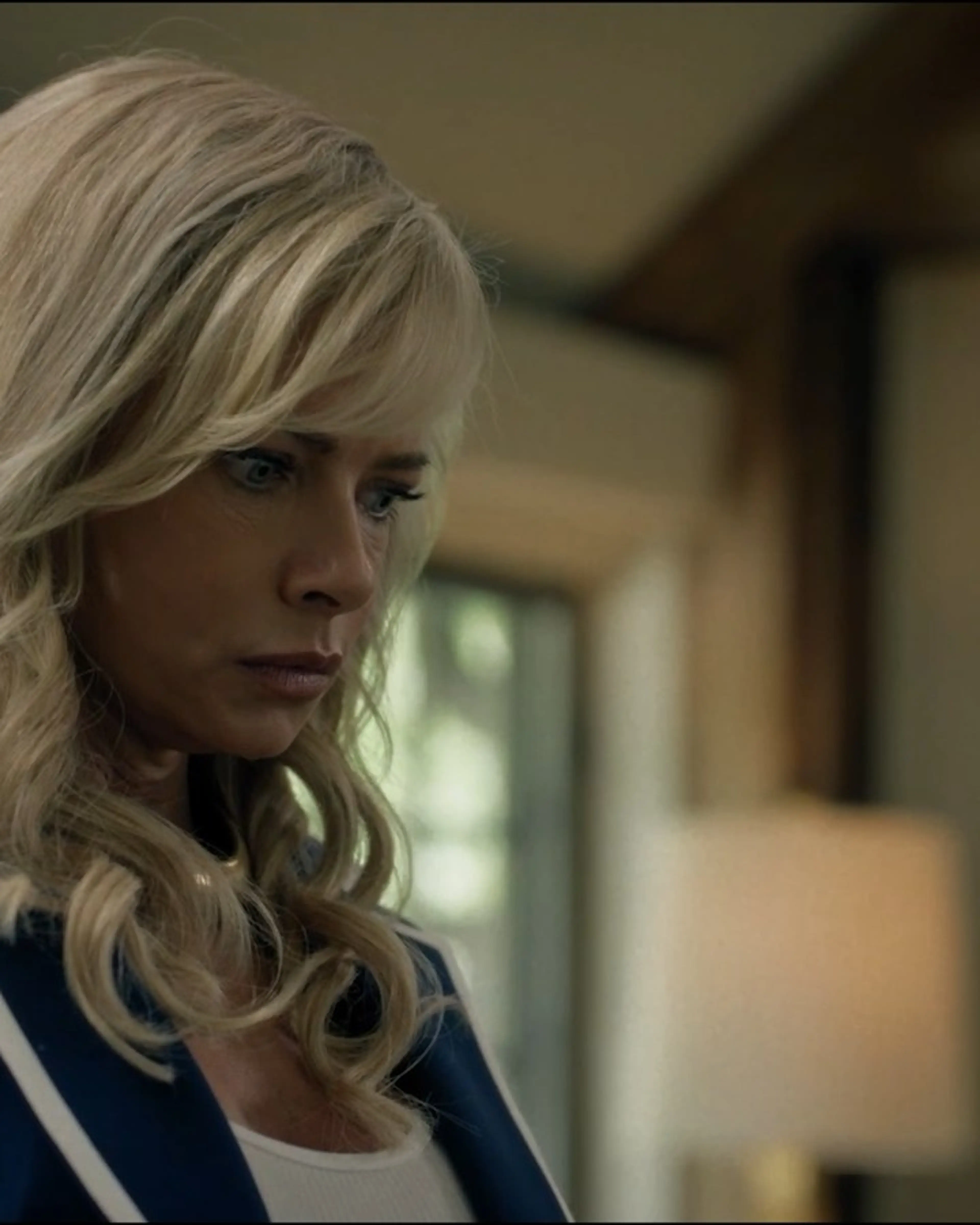 Jaime Pressly as Lexi looks to one side inside a house in Last Shot.