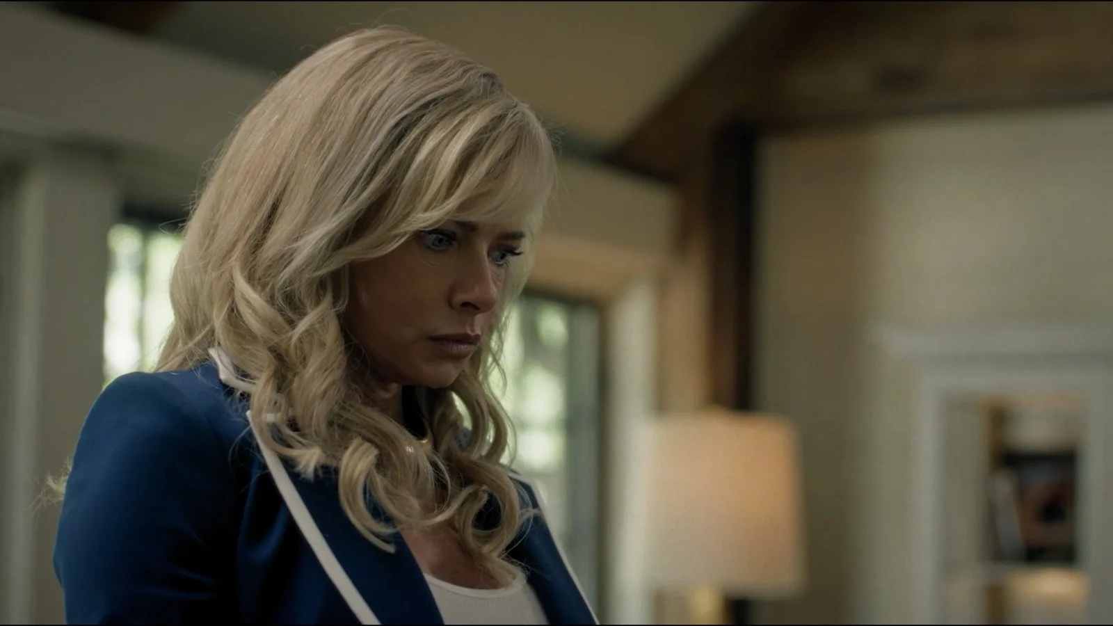Jaime Pressly as Lexi looks to one side inside a house in Last Shot.
