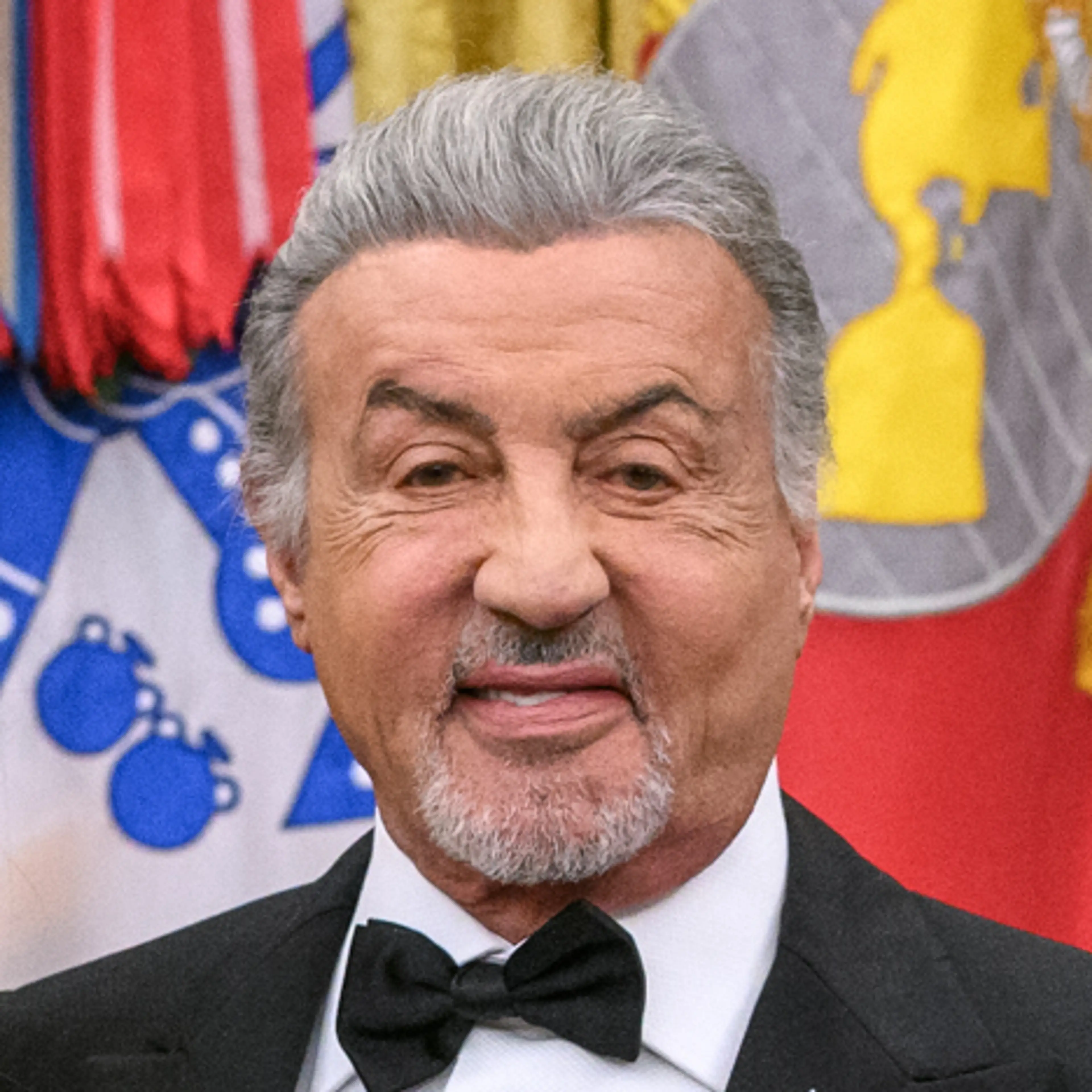 Sylvester Stallone wears a tuxedo during a 2025 Kennedy Center honorees event.