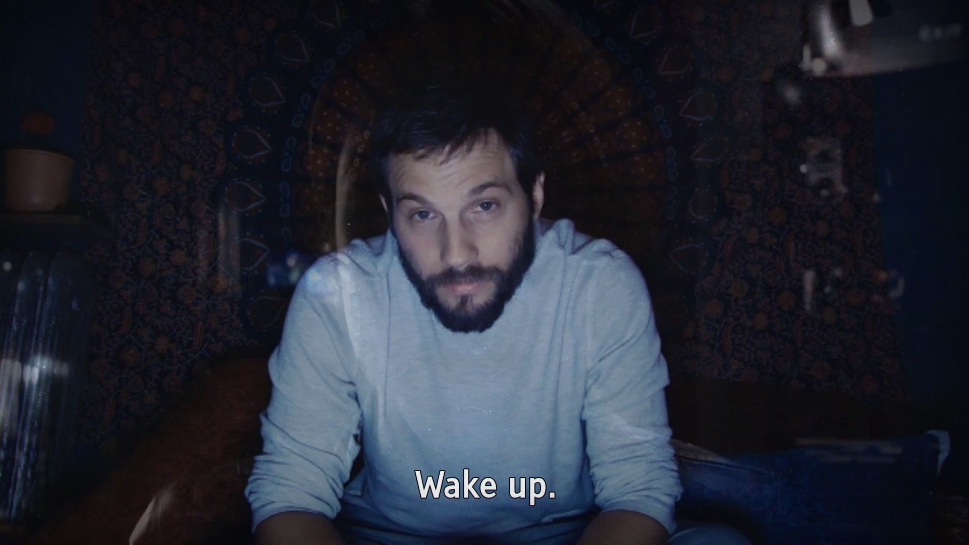 A subtitled recording shows a man looking toward the camera, illustrating how spoken words and dialogue carry clues.