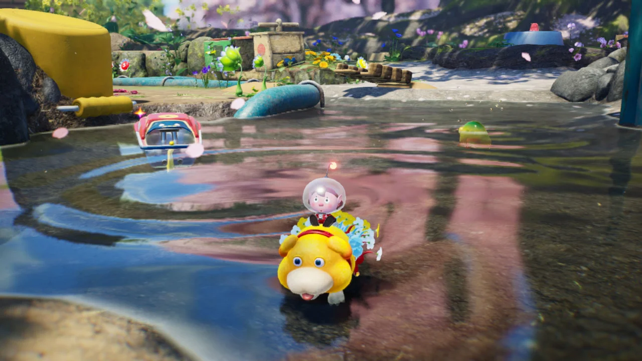 Oatchi carries explorers and Pikmin across shallow water.