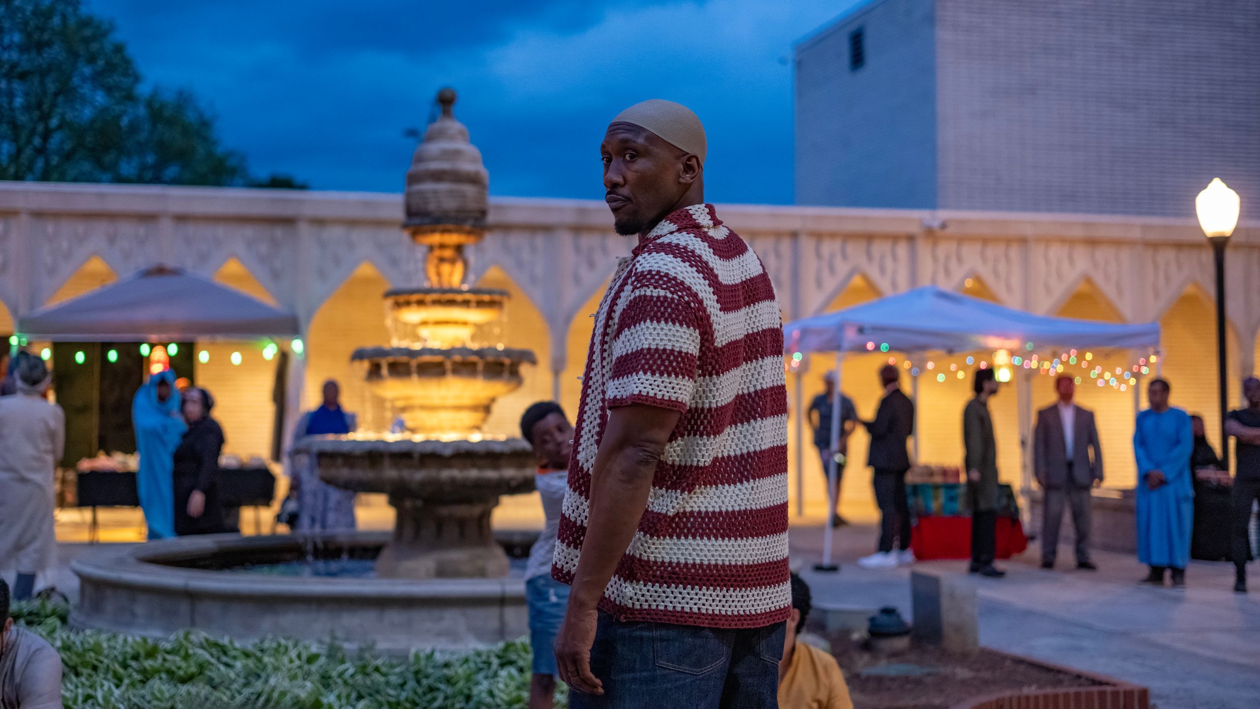 Mahershala Ali as Latif stands outdoors in Your Mother Your Mother Your Mother.