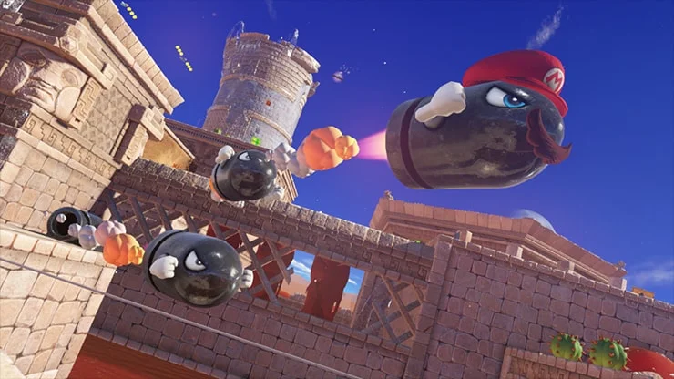 A Bullet Bill flying through a stone area wears Mario’s cap and Cappy’s eyes.