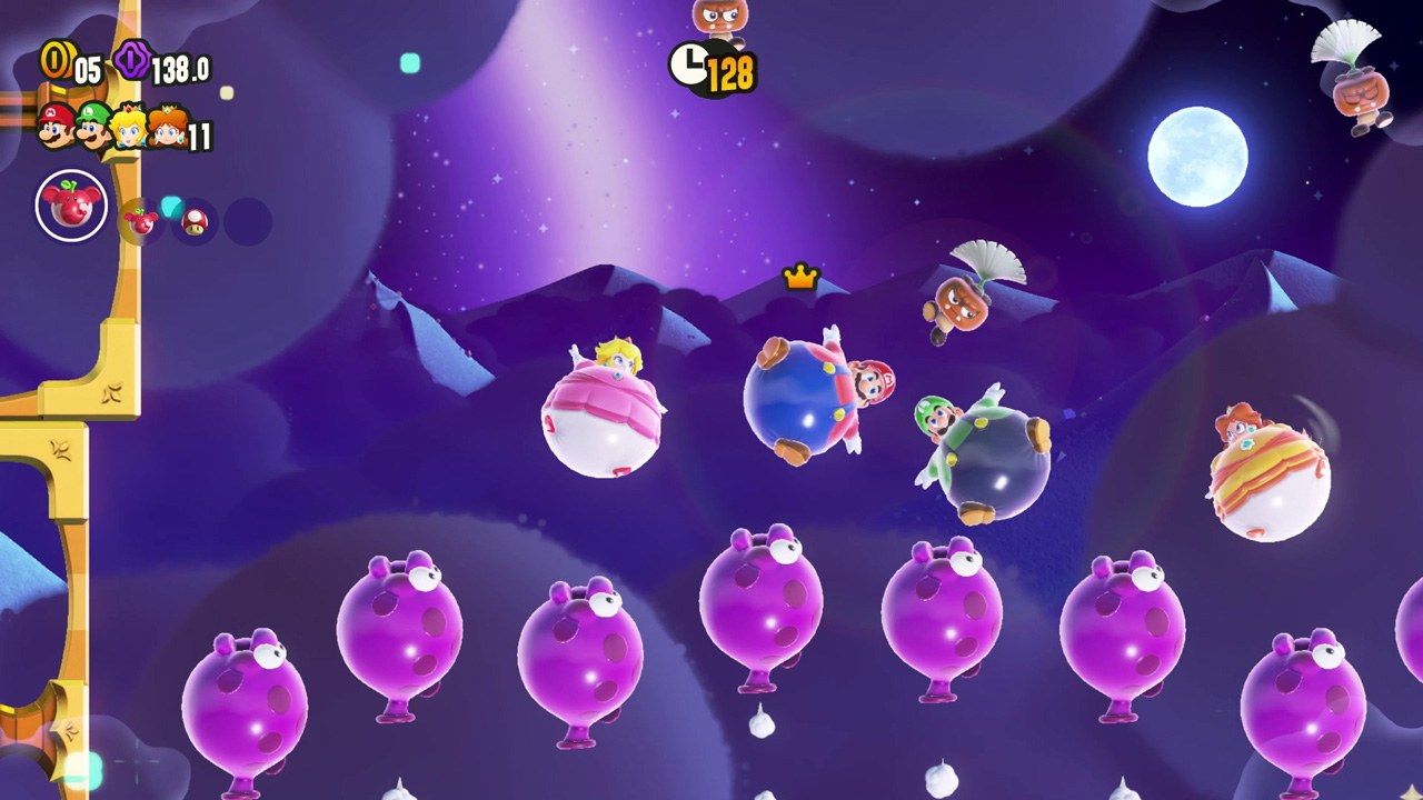 Four characters float among purple balloons in a Wonder stage.