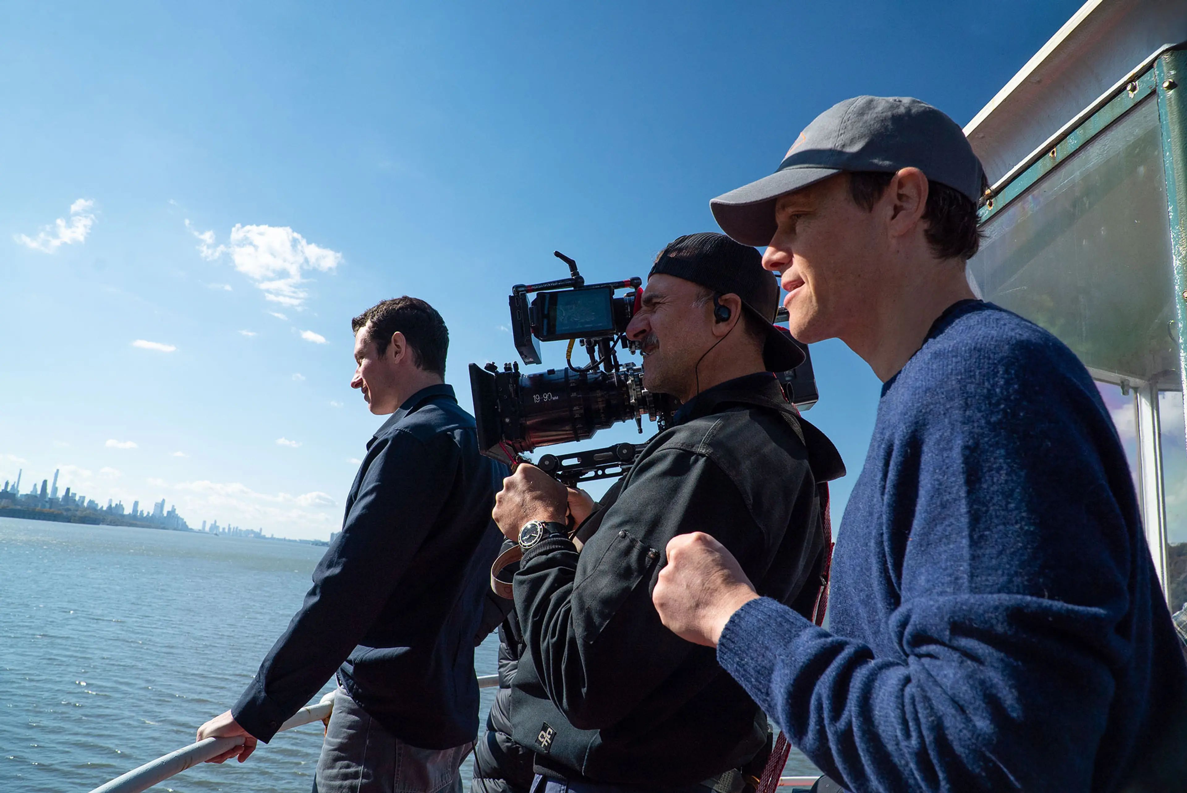 Callum Turner stands beside the camera crew during location filming for One Night Only.