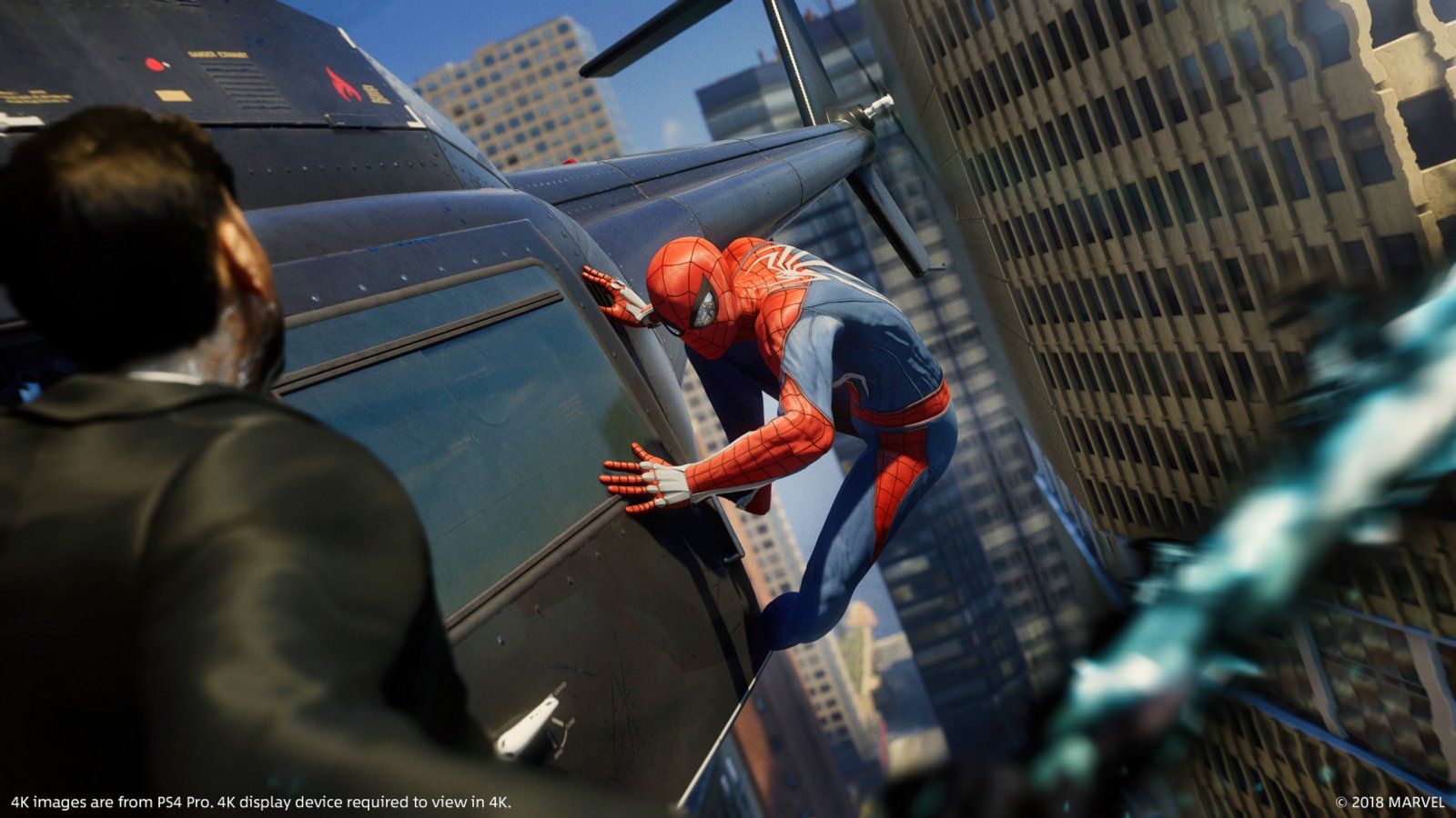 Spider-Man leaps from the side of a building while an armed man watches from the foreground.
