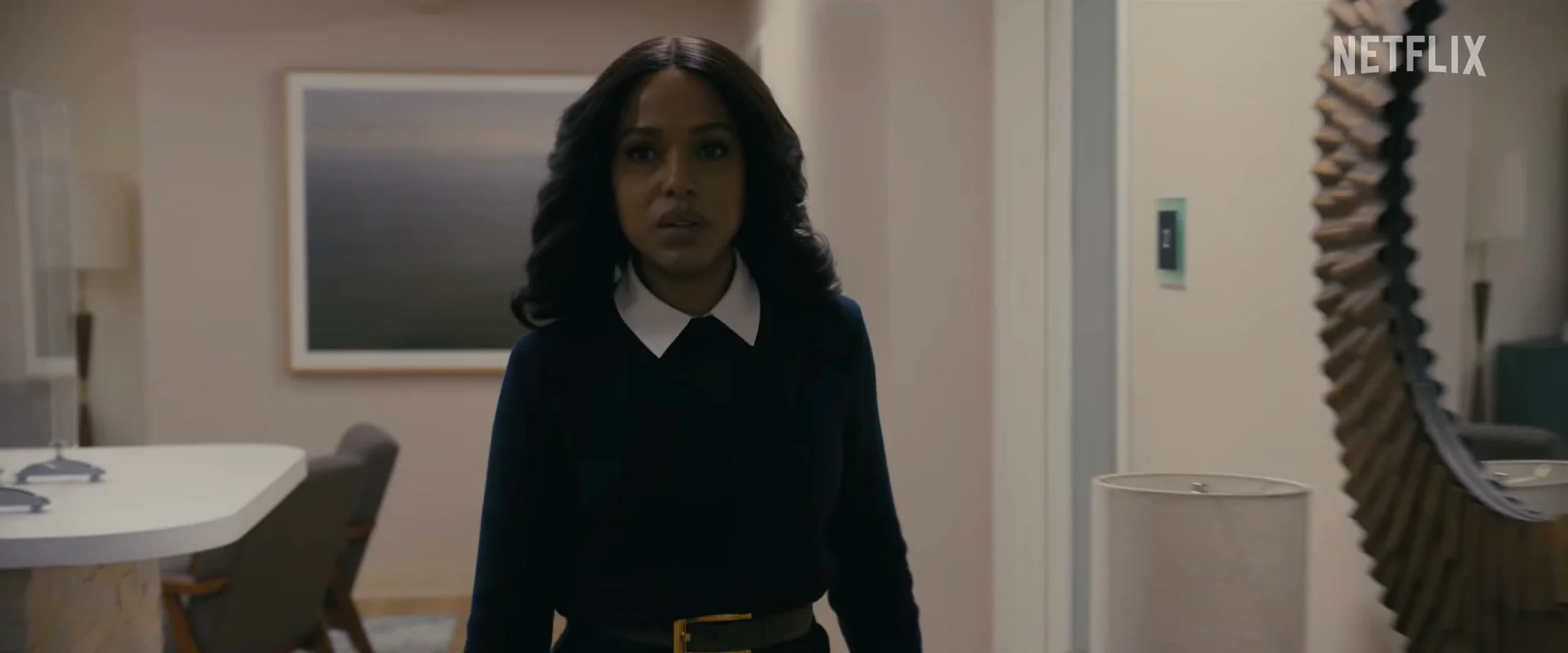 Kerry Washington as Abigail Kimball stands inside the family home during a tense moment in Animals.