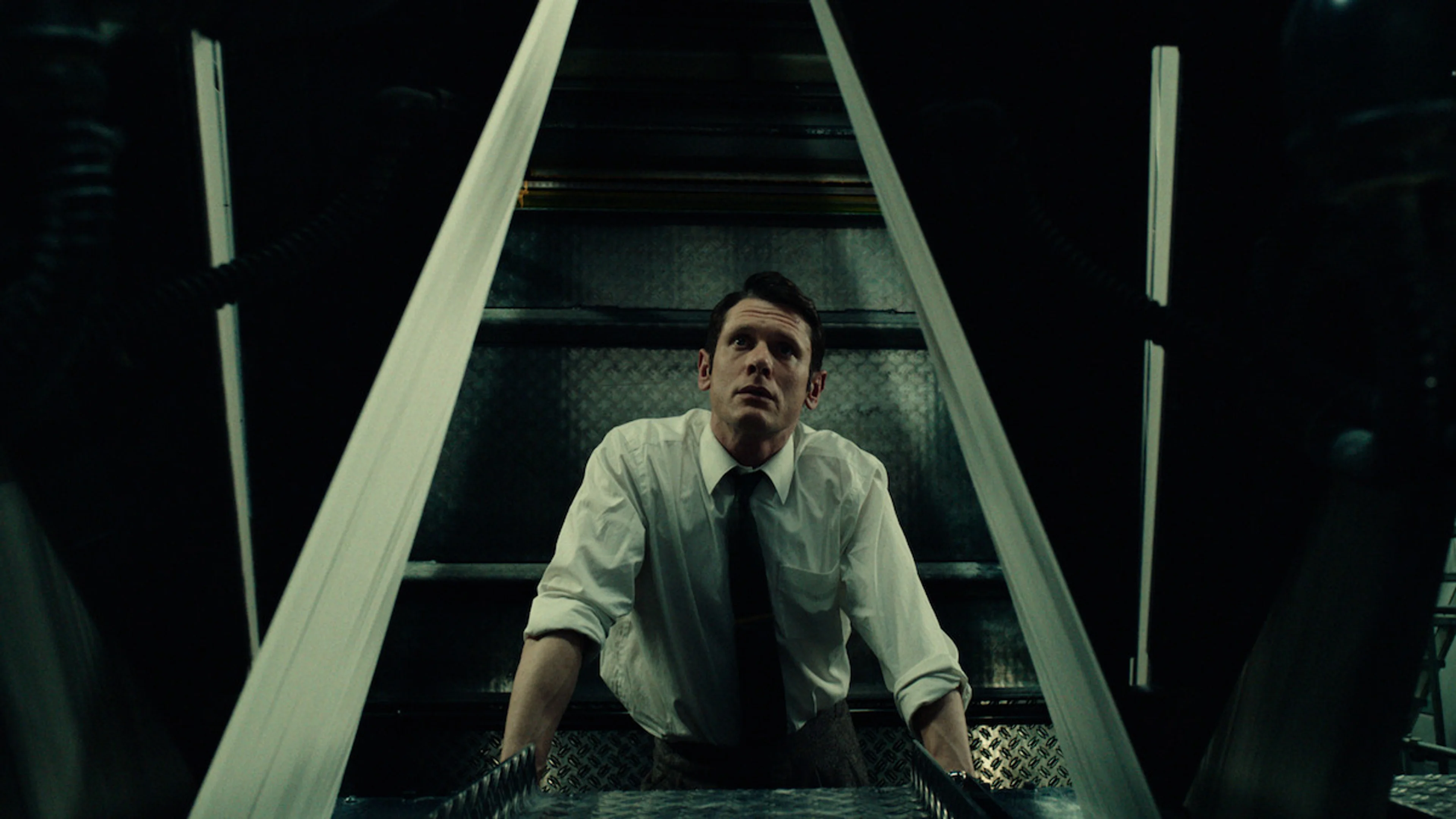 Jack O’Connell as Larry Lamb looks up from a printing press inside The Sun newsroom in Ink.