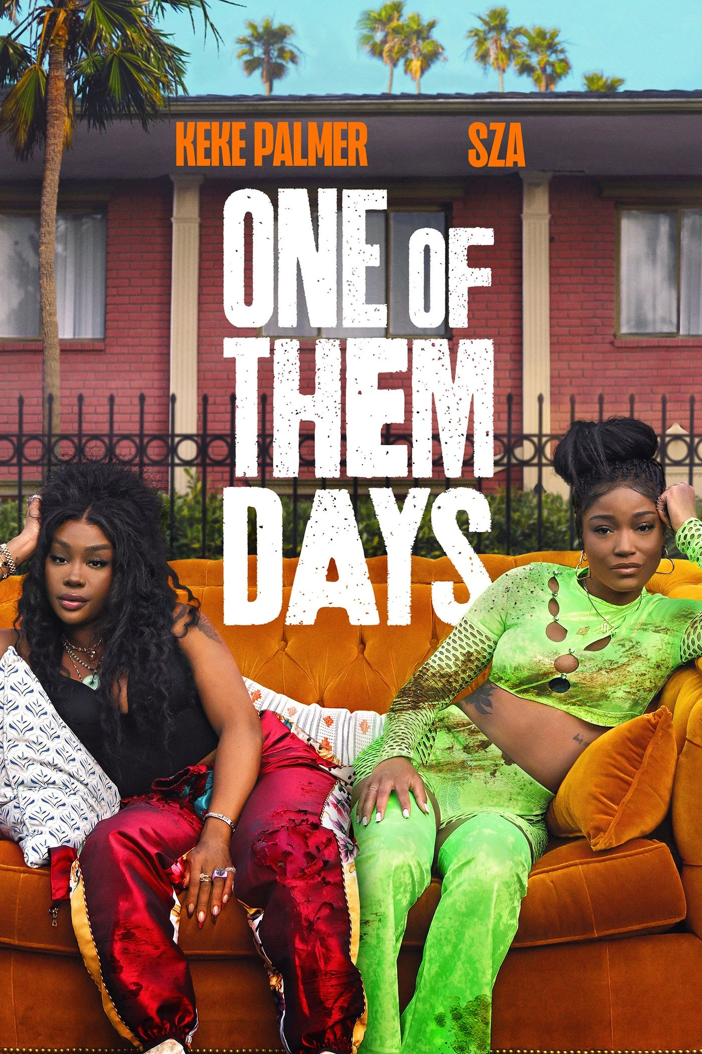 Official One of Them Days poster with SZA and Keke Palmer seated on a couch outside their apartment building, beneath the title.