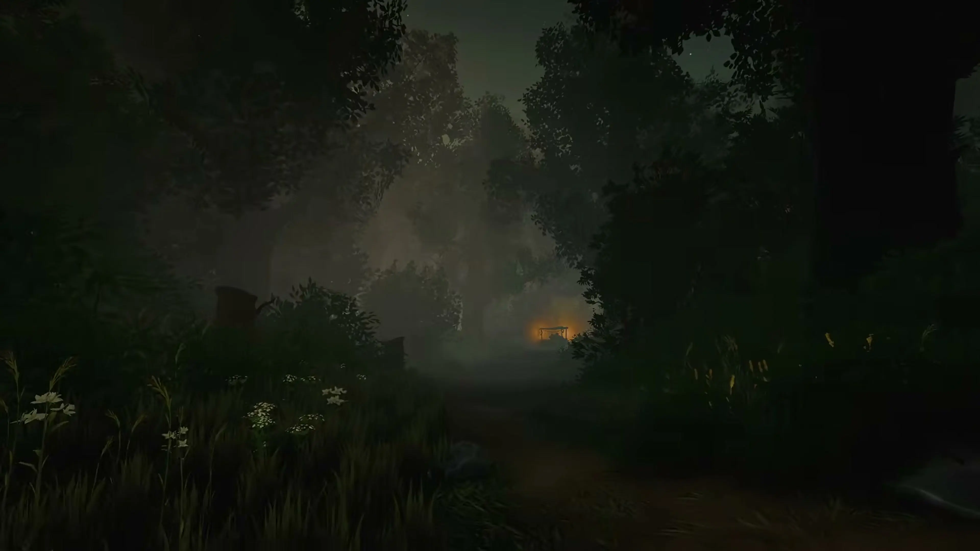 A narrow village path disappears into fog toward a distant warm light.