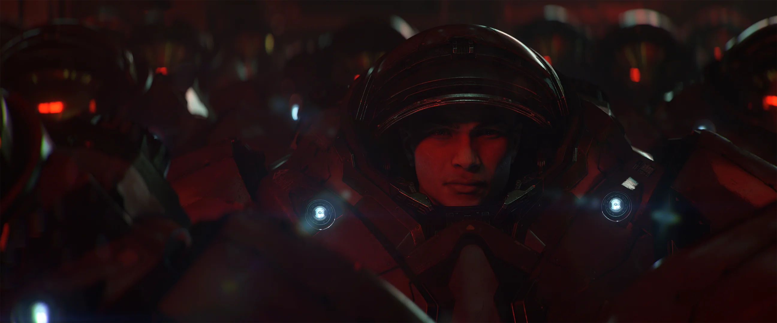 A Dominion recruit sits inside red powered armor in the new StarCraft announcement cinematic.