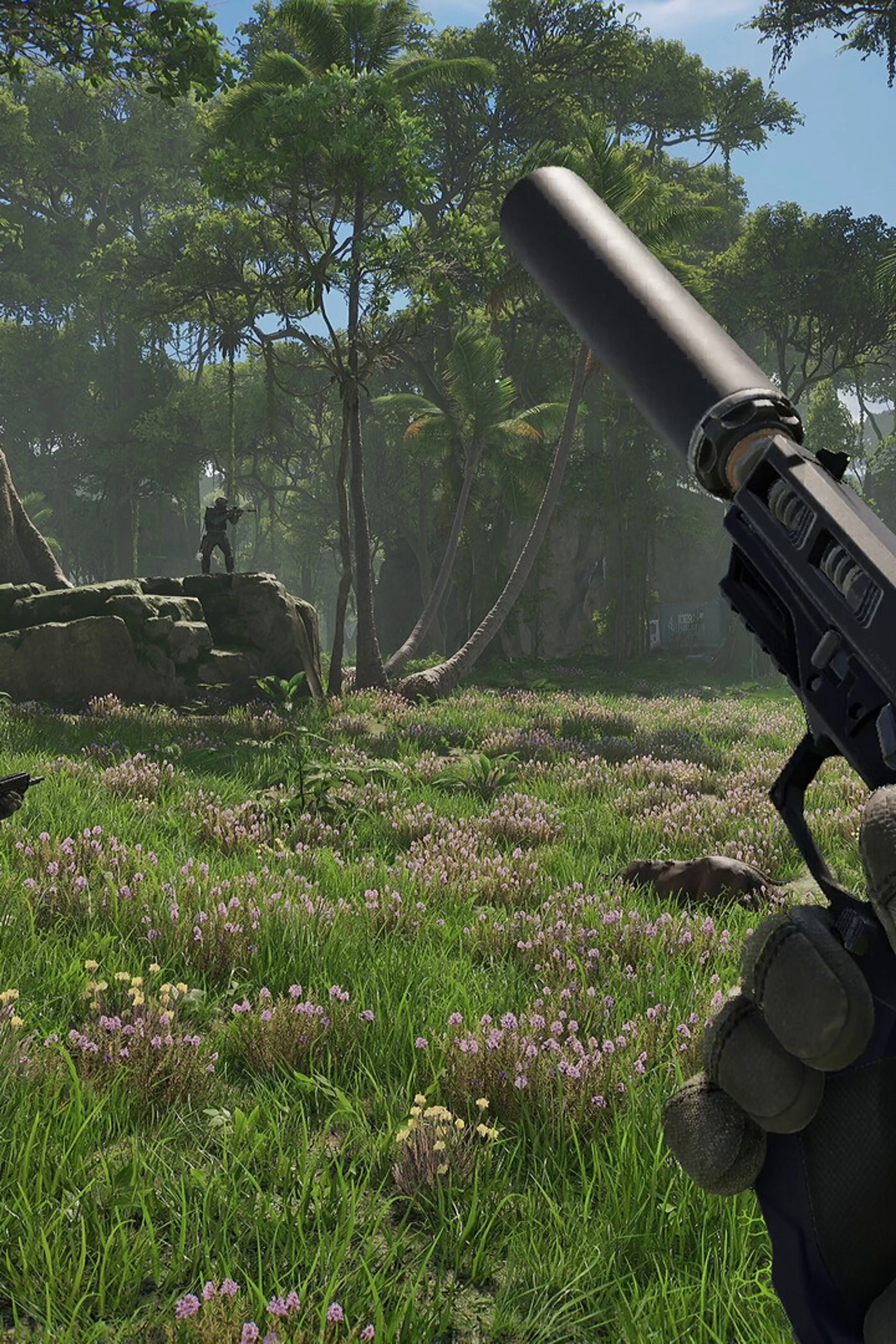 A first-person weapon and armed squad members in a flower-covered clearing in PUBG: Black Budget.