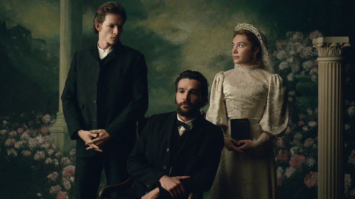 Mike Faist, Christopher Abbott and Florence Pugh pose as Charles, Adam and Cathy in a formal East of Eden portrait.