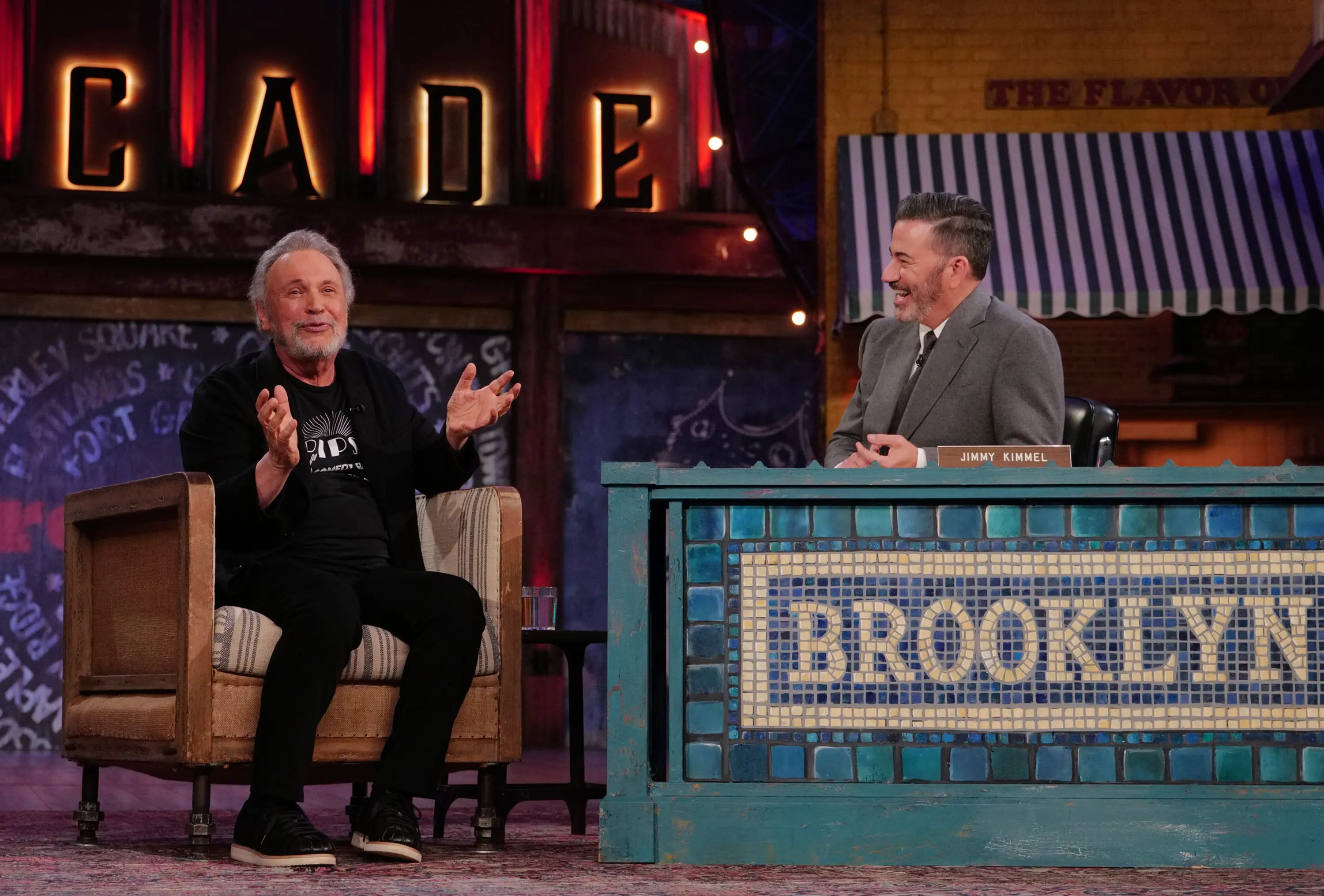 Billy Crystal gestures while talking with Jimmy Kimmel in the Brooklyn studio.